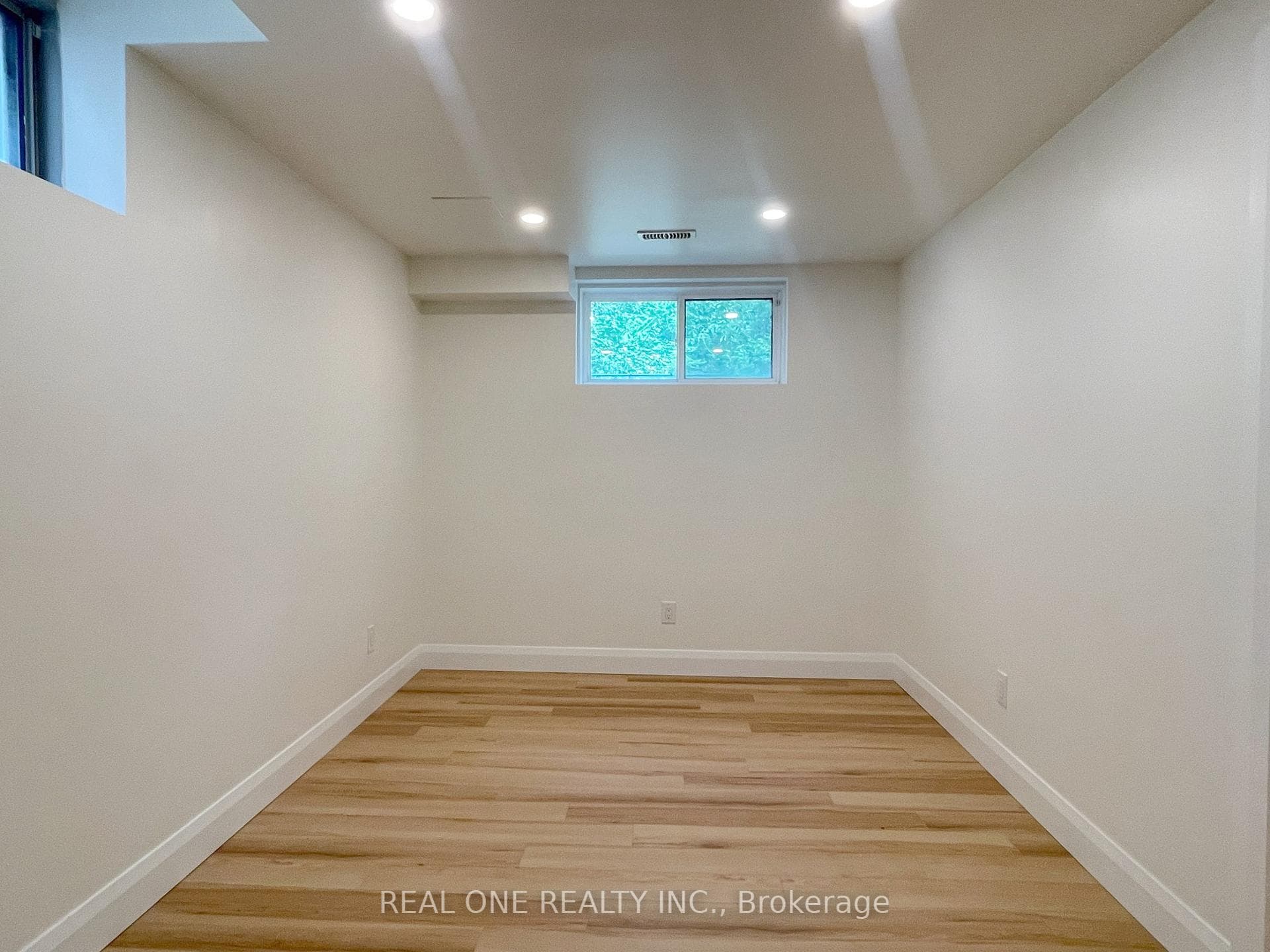 Living Room With Two Windows and Potlight