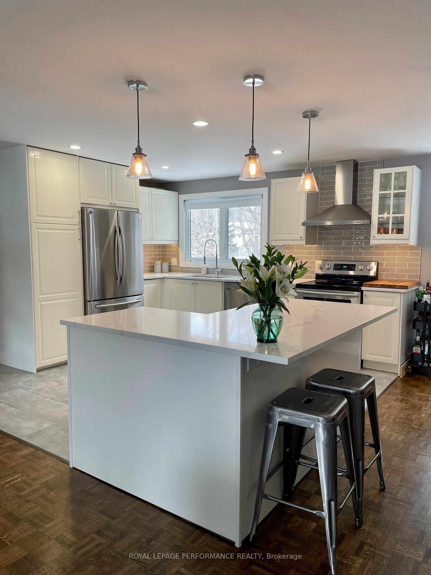 Kitchen overlooking large backyard