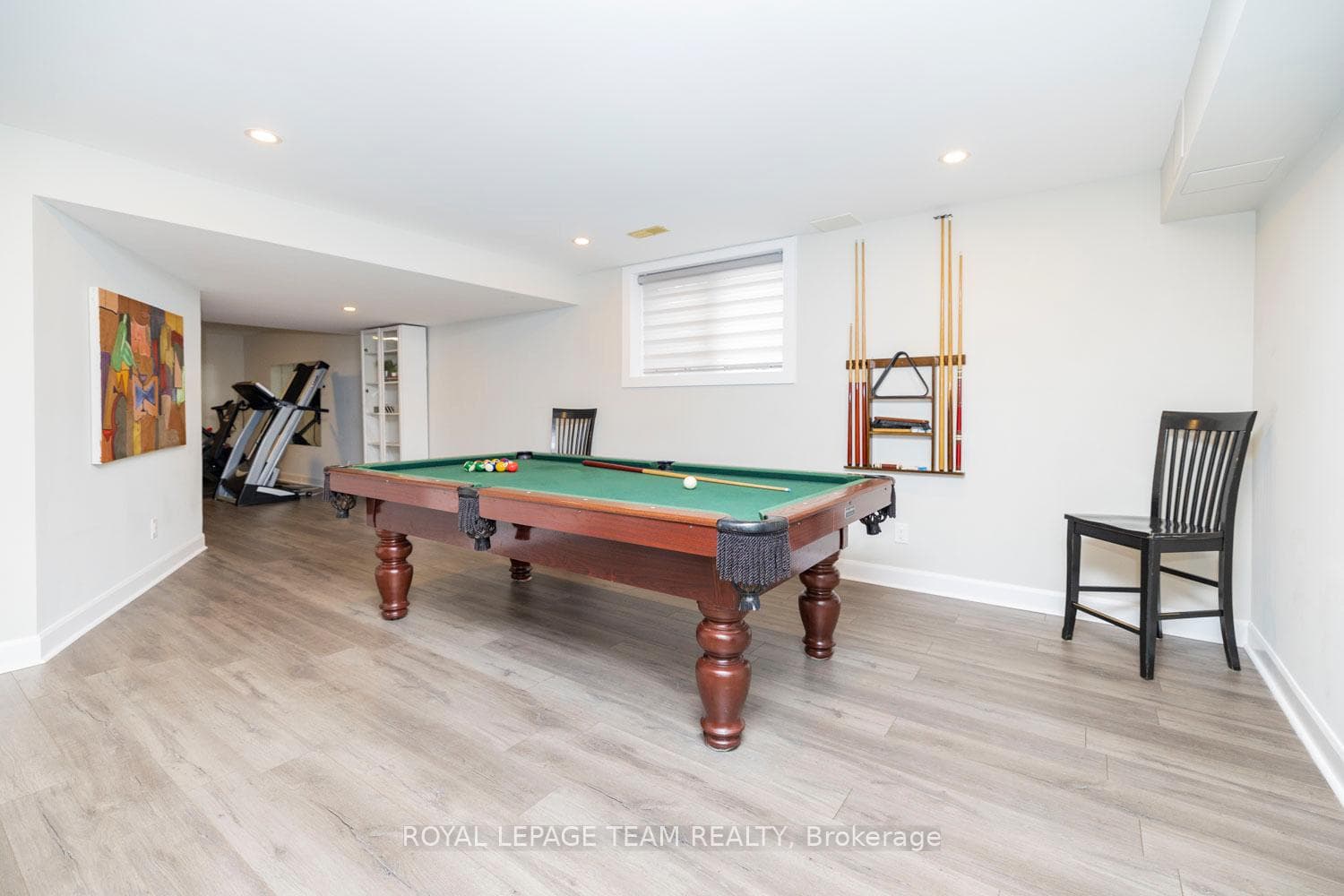 Large windows and extensive pot lights throughout.