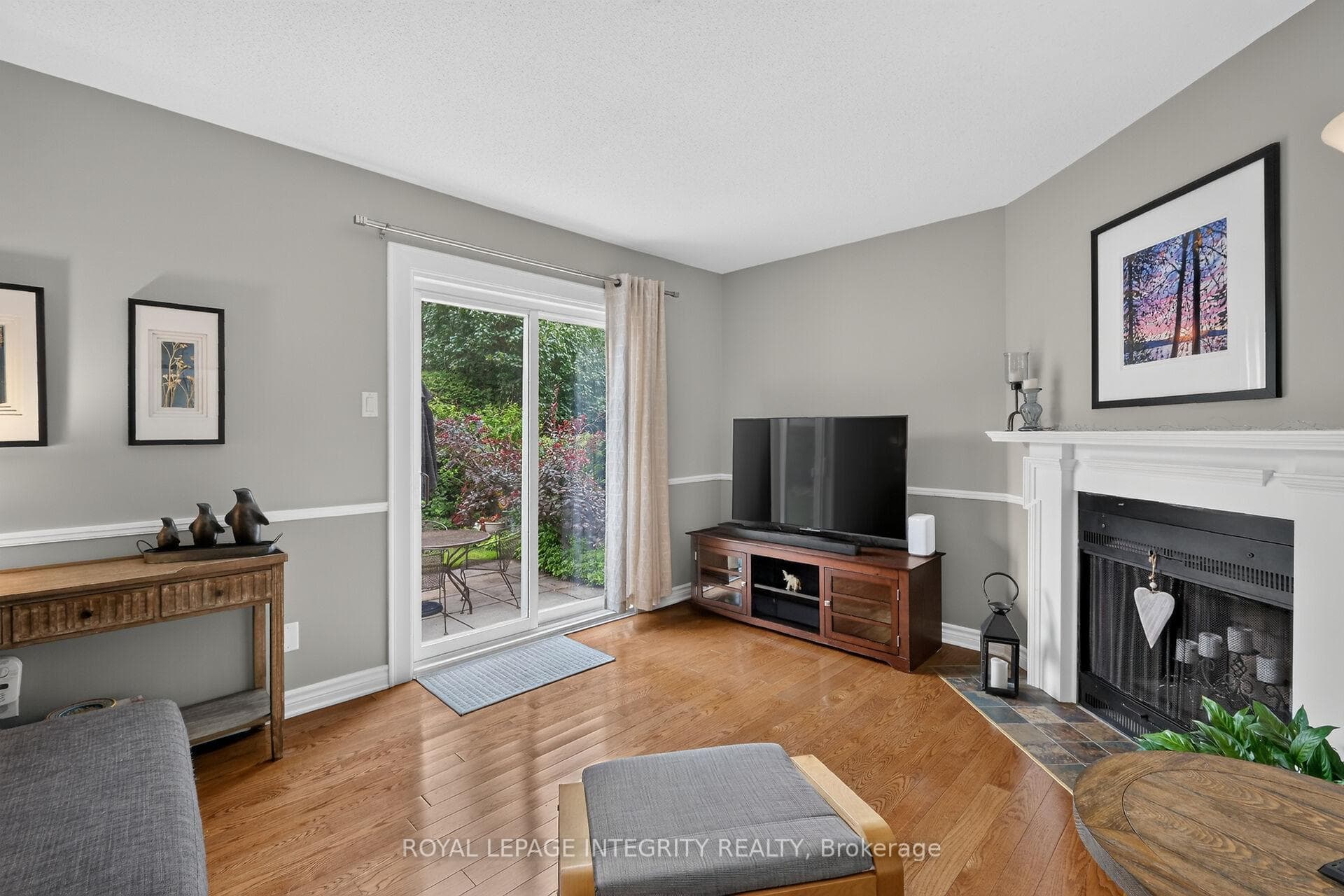 Fam rm with cozy FP and patio door to rear patio.