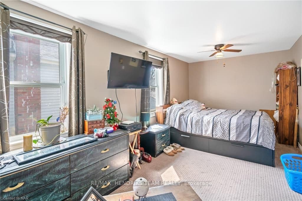 Primary bedroom with sitting area.