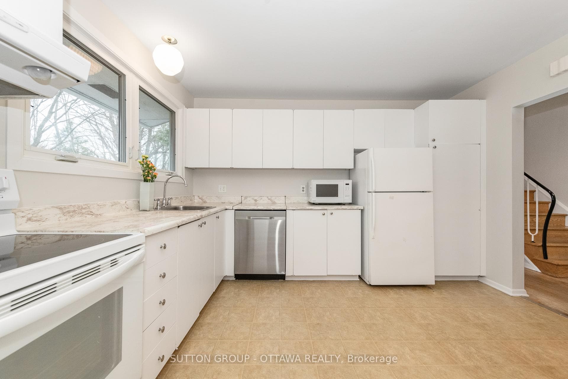 the kitchen with view into the backyard