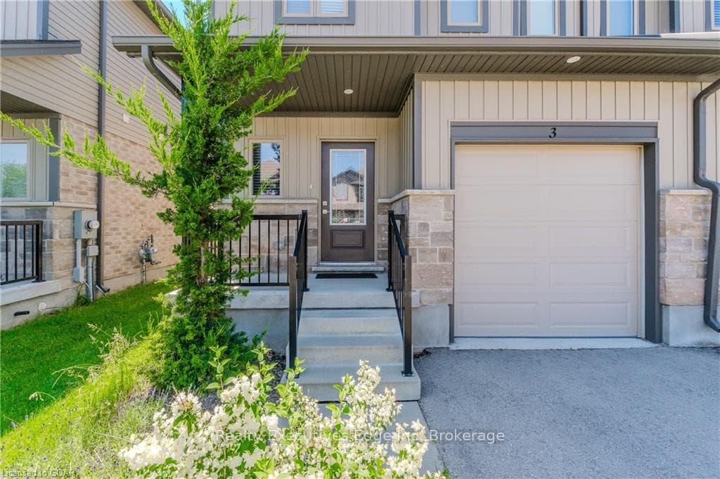 Doorway to property featuring a garage