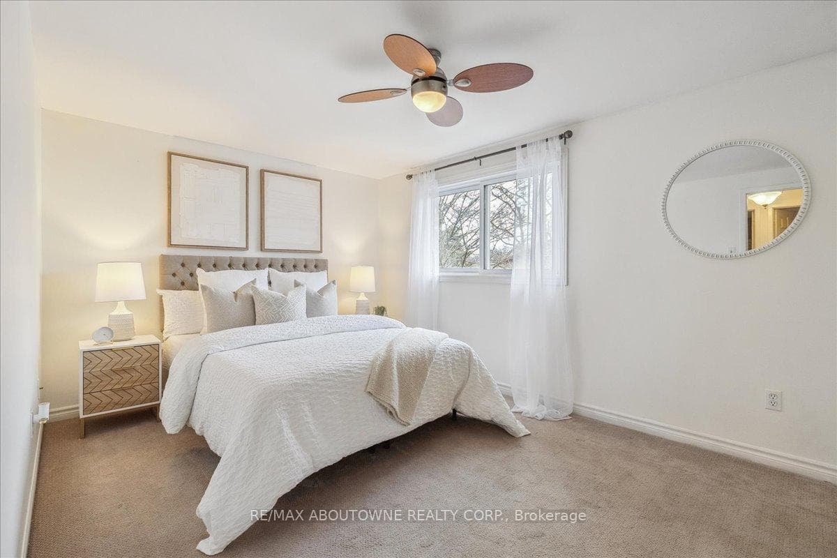 spacious primary bedroom with His & Hers closets