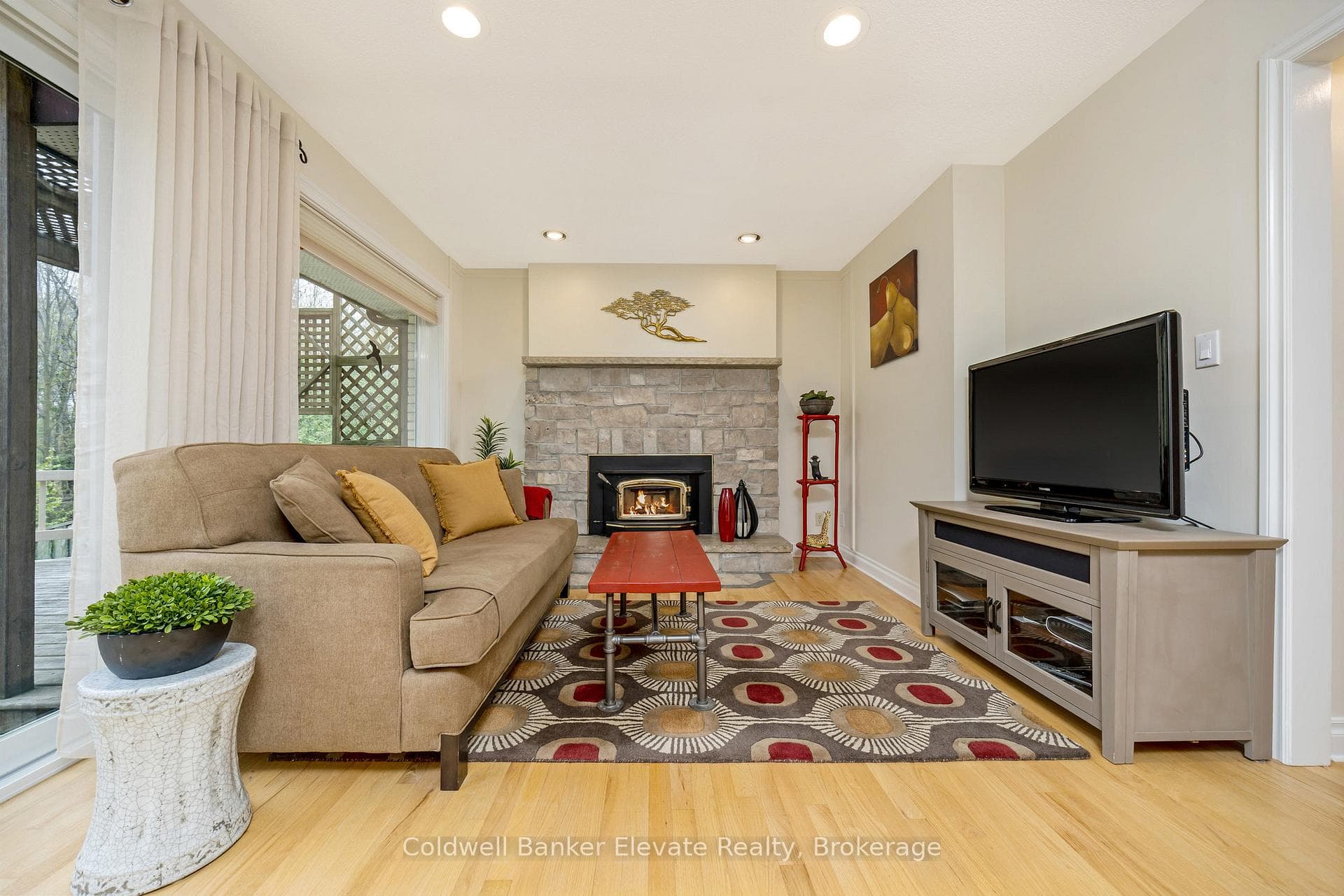 Family Rm - Wood FP, Stone Surround, Forest View