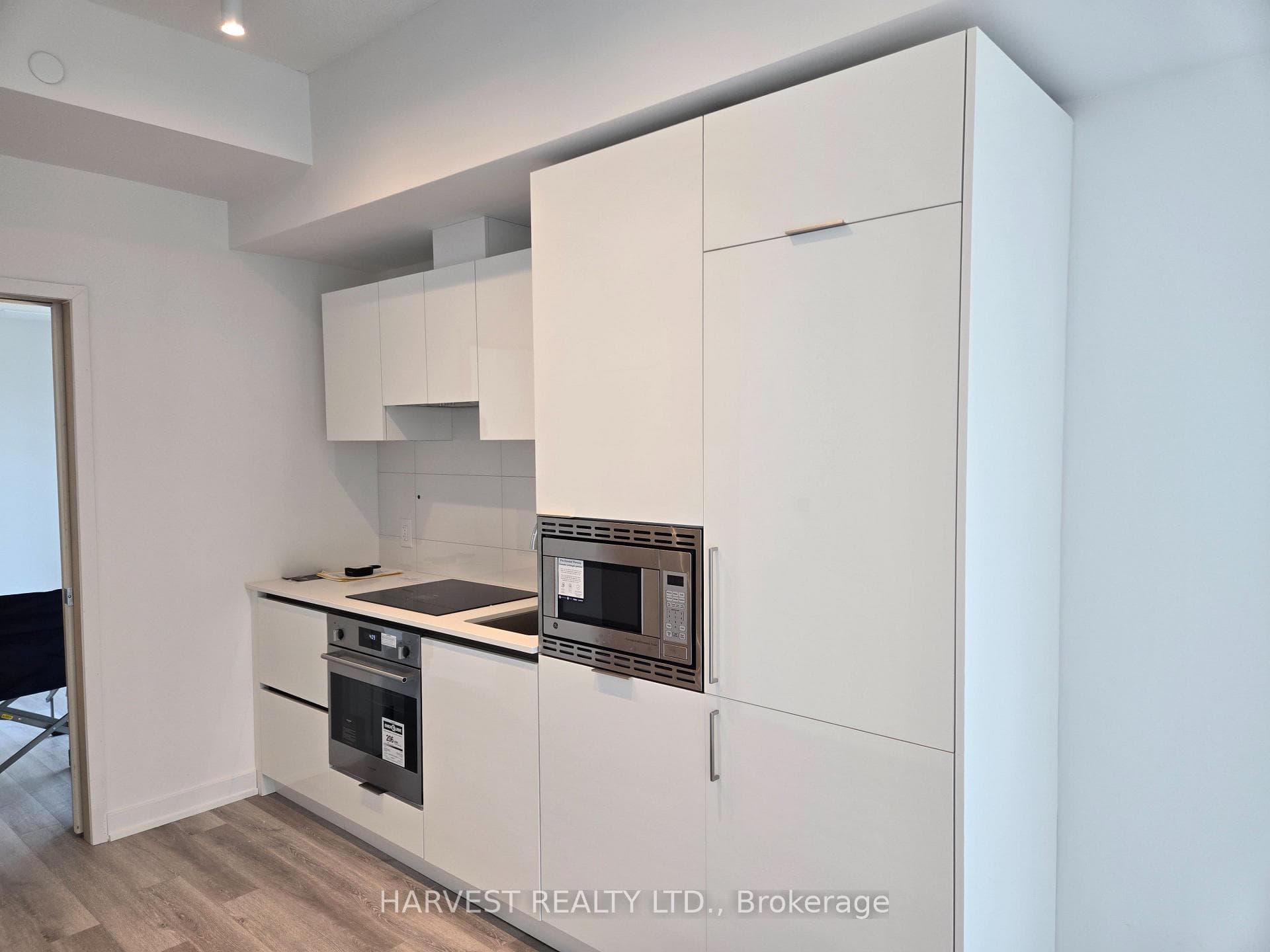 Fridge, microwave, stove top, oven and sink
