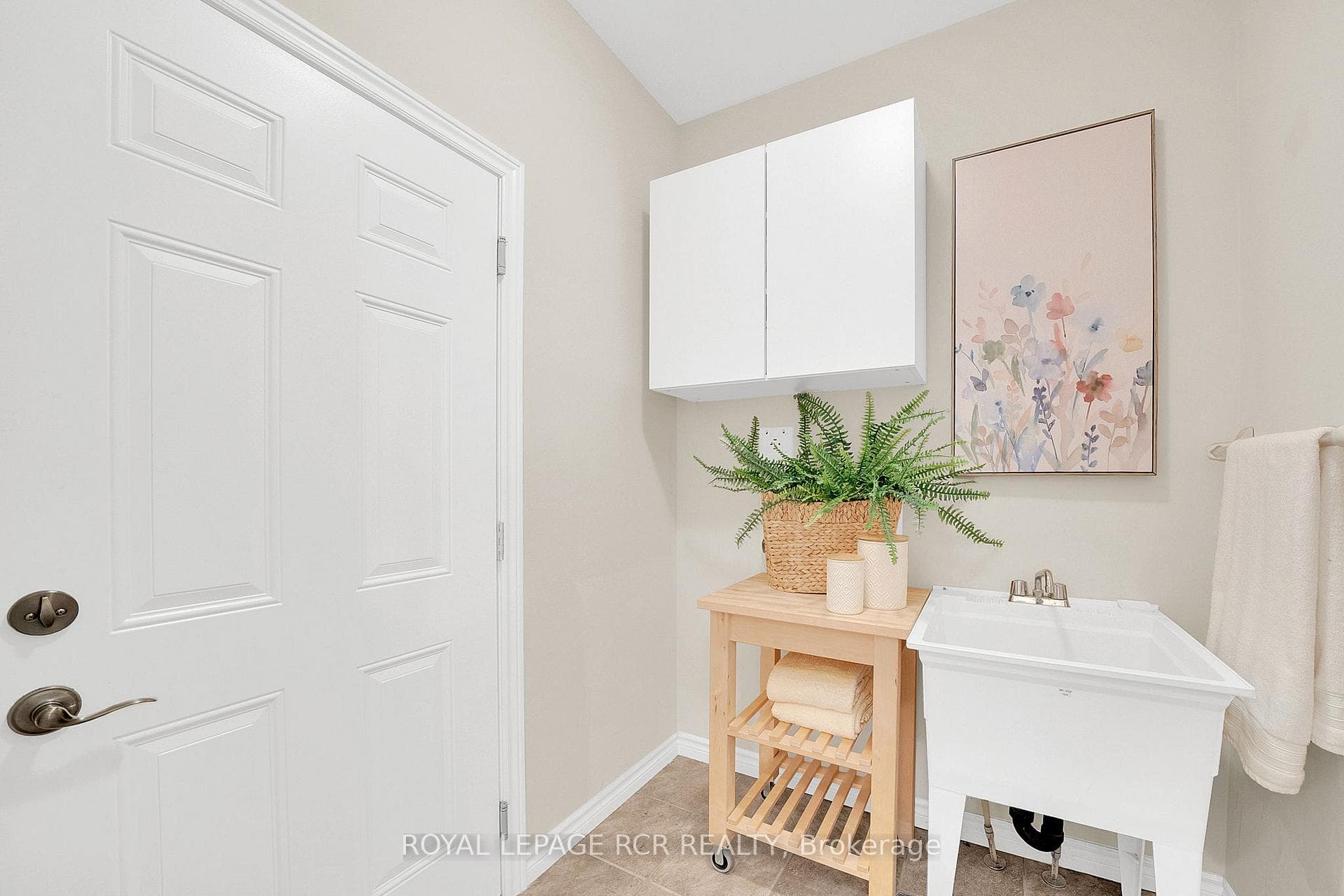 Main Level Laundry/Mud Room with Access to Garage