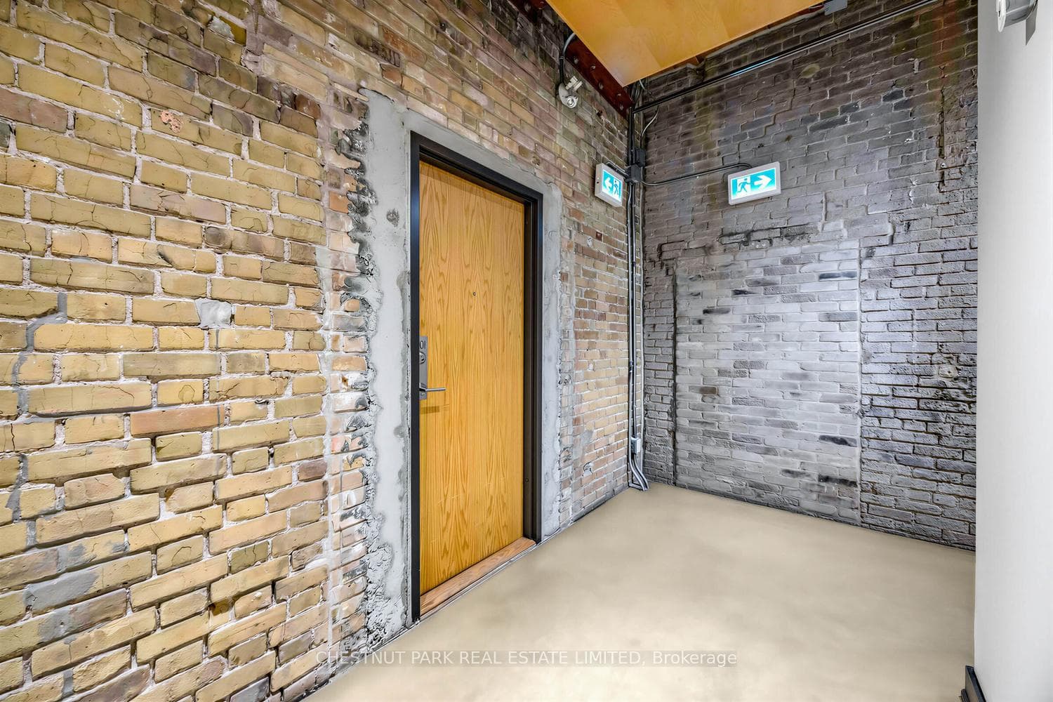 Original warehouse finishes leading to suite door