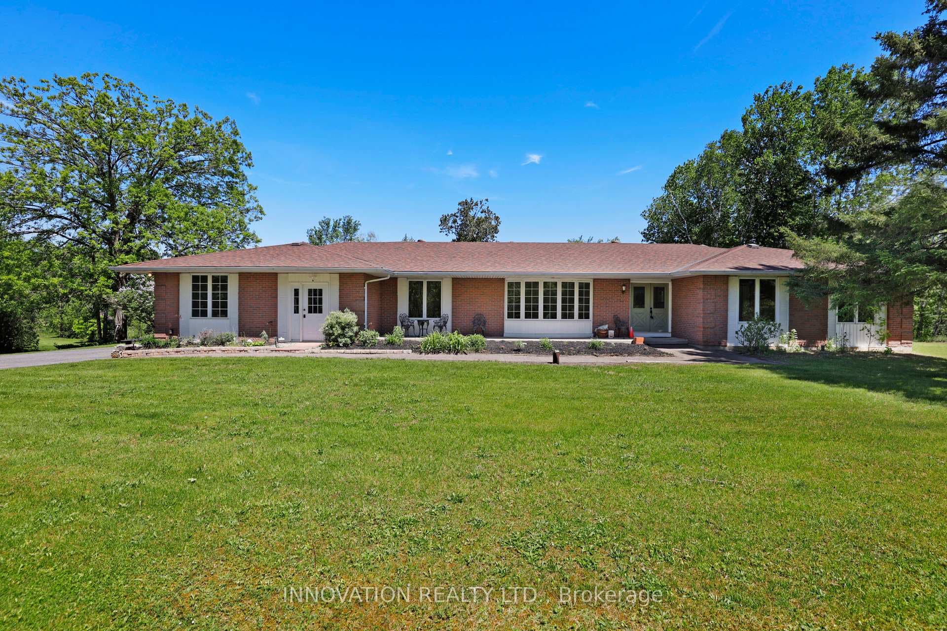Sprawling brick bungalow on private 5 acres