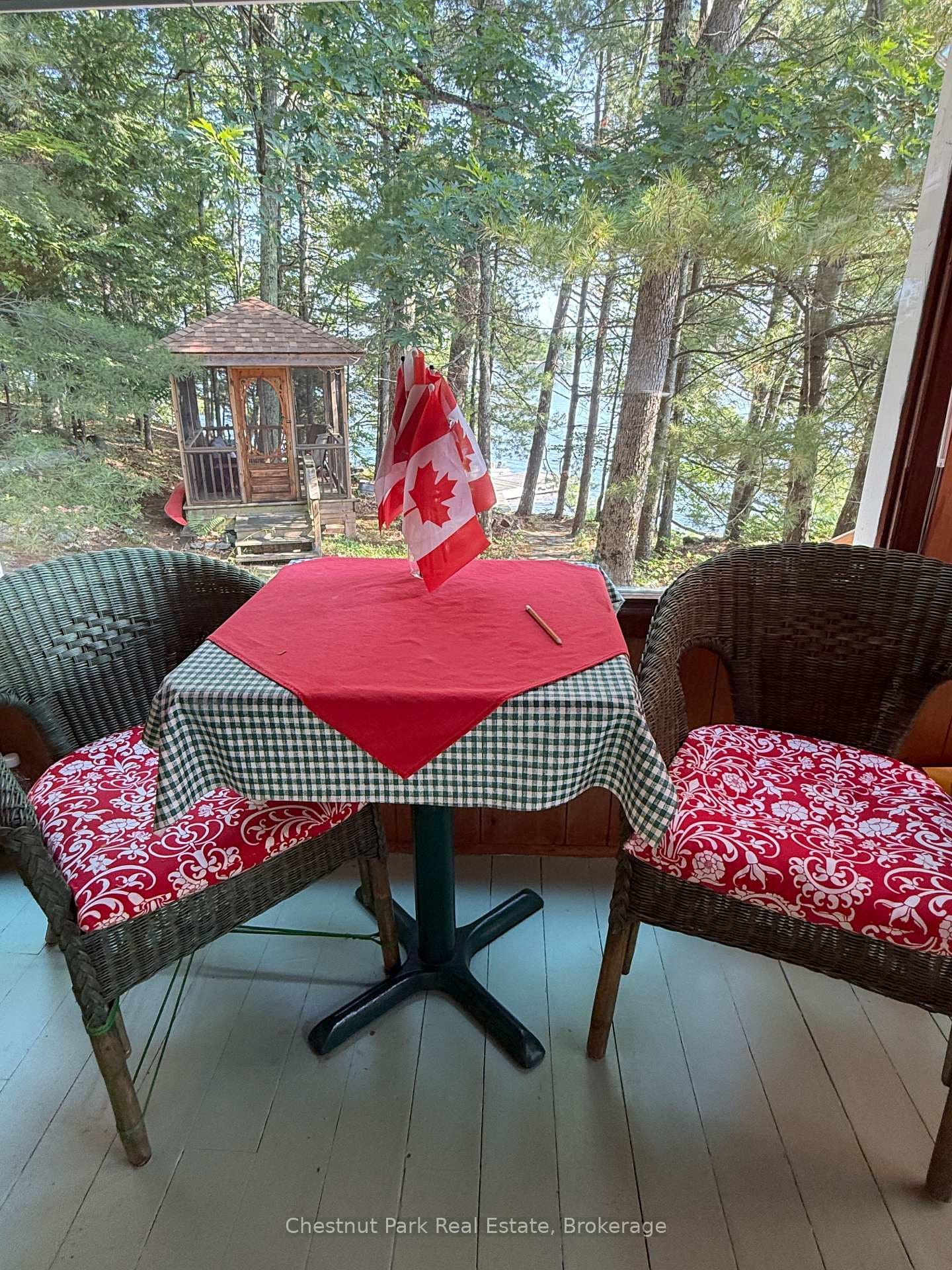 Bistro table looks out to screened gazebo