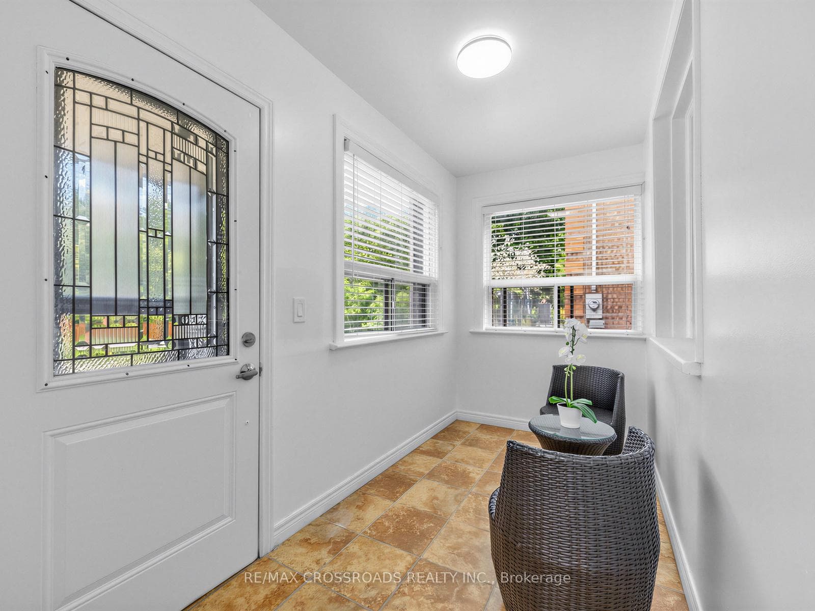 Sun filled entry room porch.
