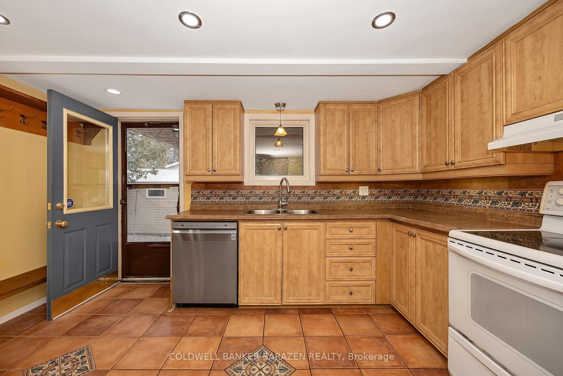 Large eat-in kitchen -door leading to covered deck