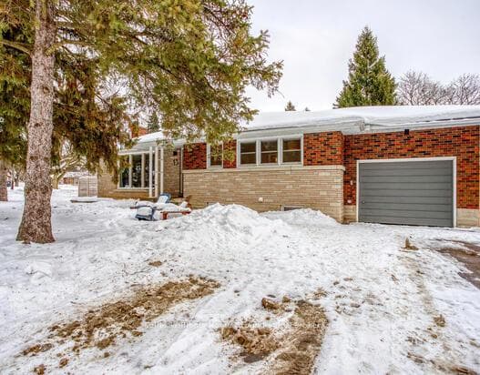 Front of house, garage, and driveway