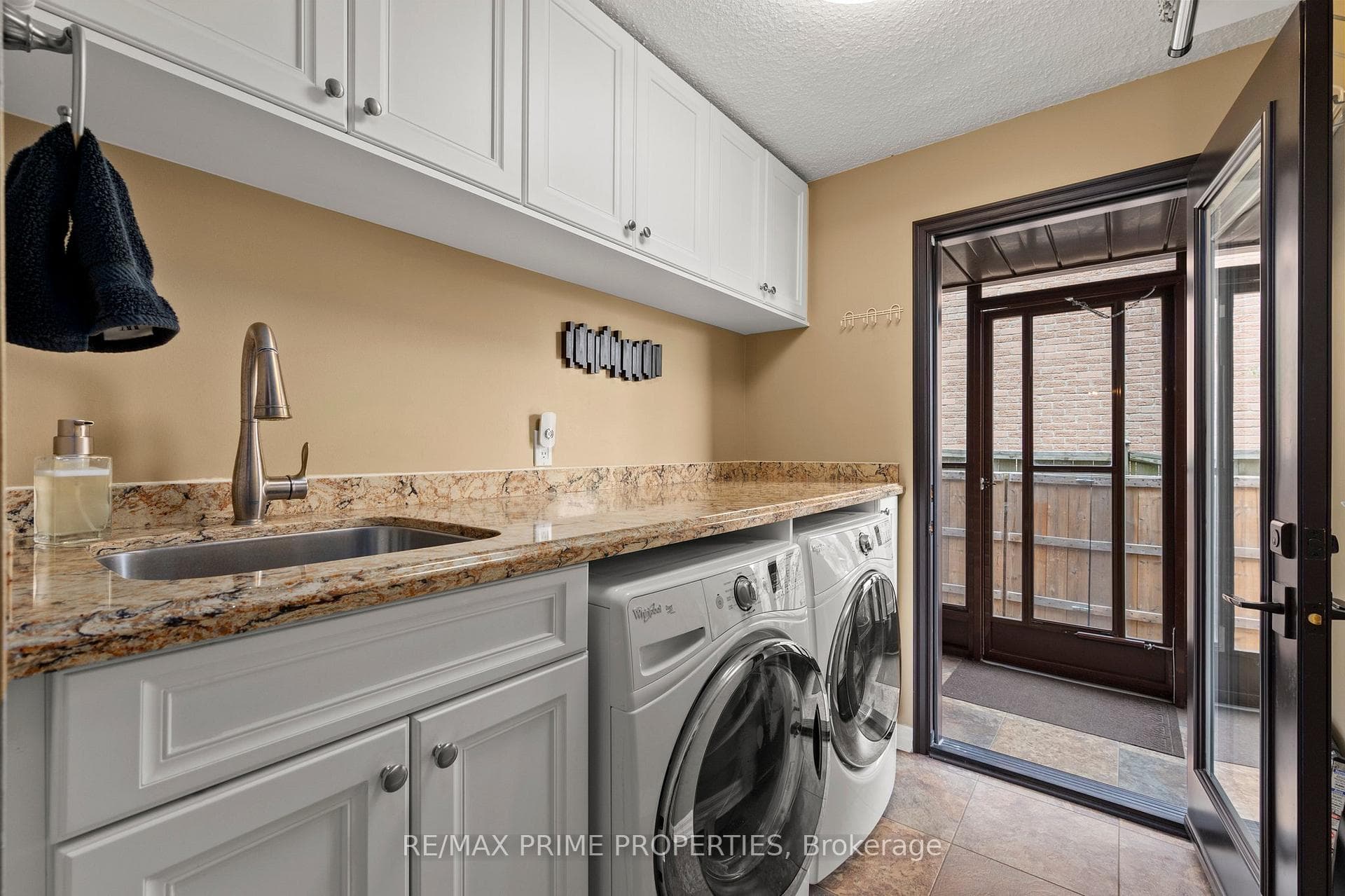 Updated main floor laundry with quartz countertops