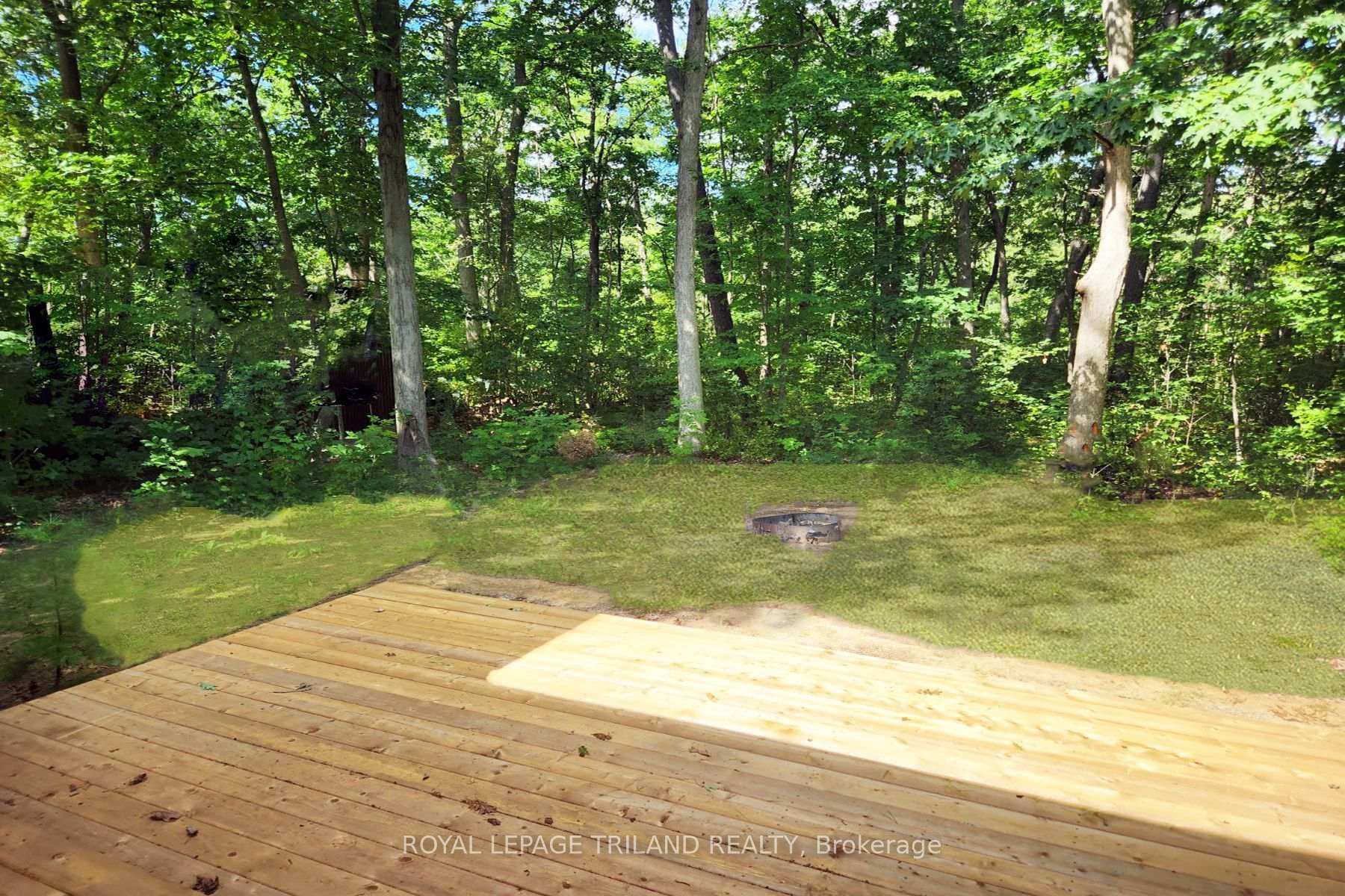 Backyard w/ mature treed privacy barrier