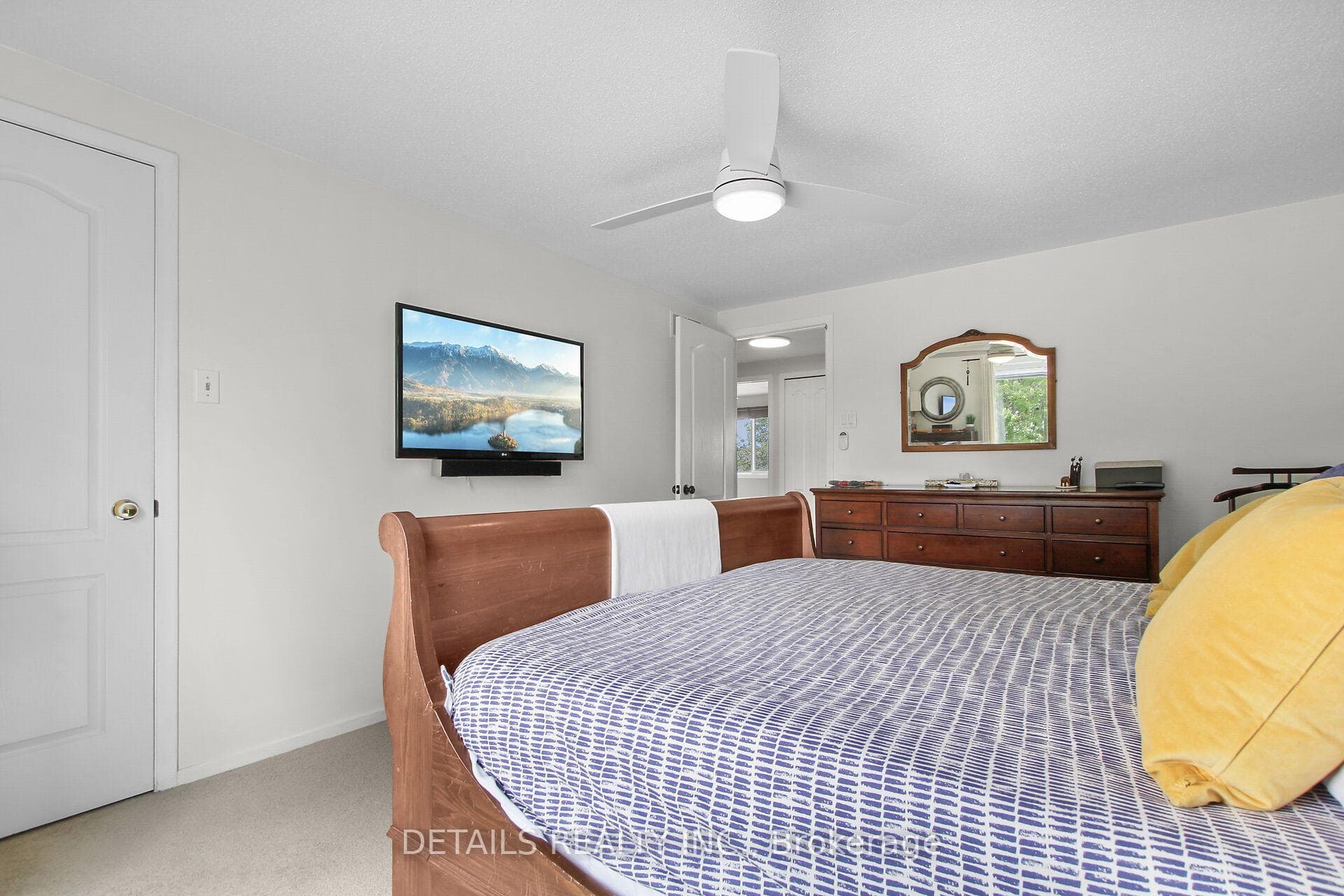 Primary bedroom with a walk-in closet