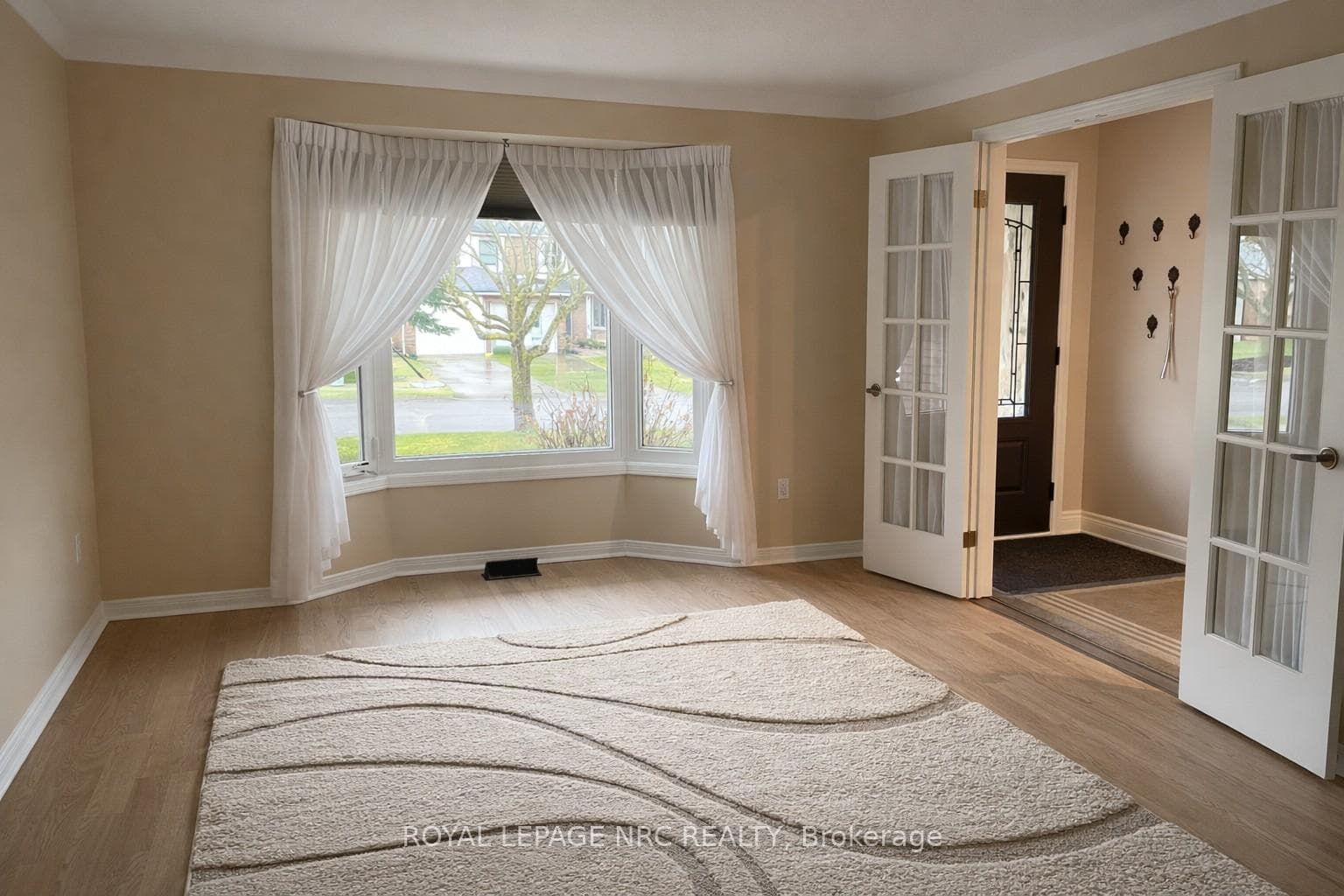Living Room with bay window, hardwood floors