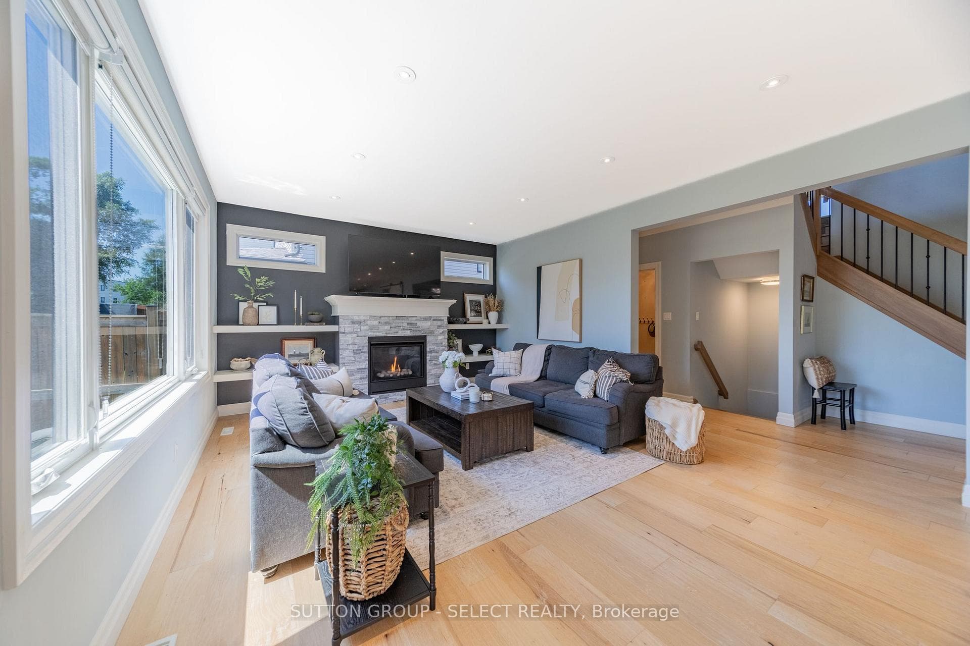 Living room with gas fireplace and built-ins