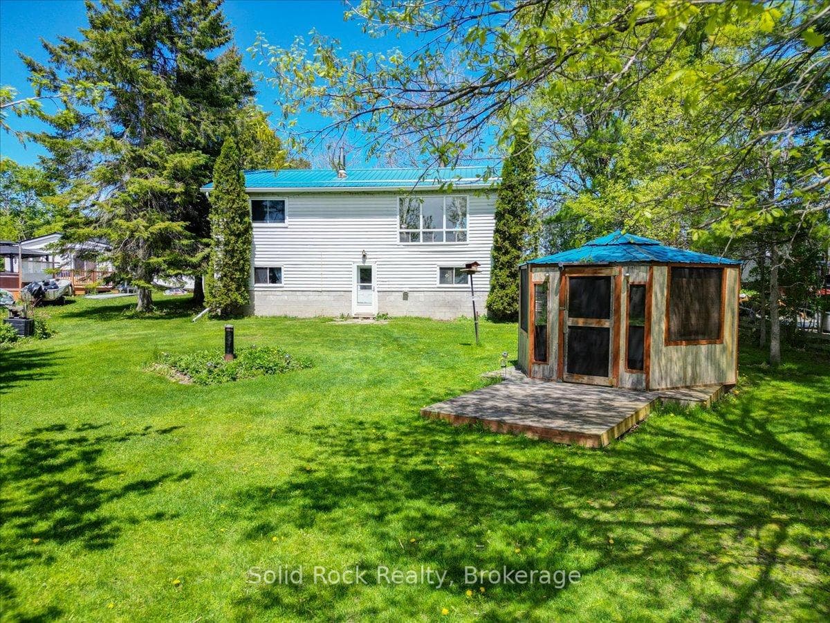 Waterfront side with walkout basement door