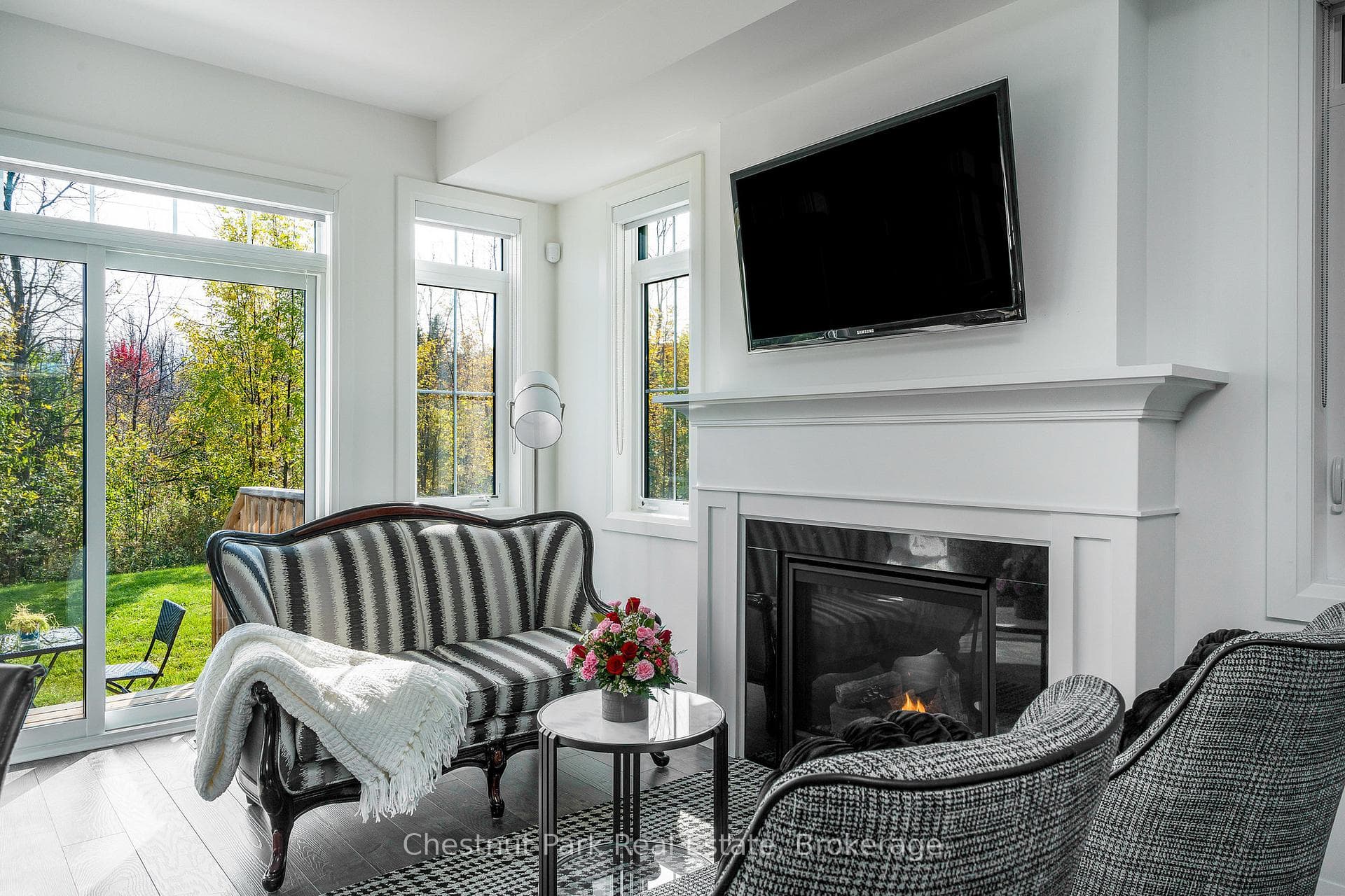 Living room w/gas fireplace and door to back yard
