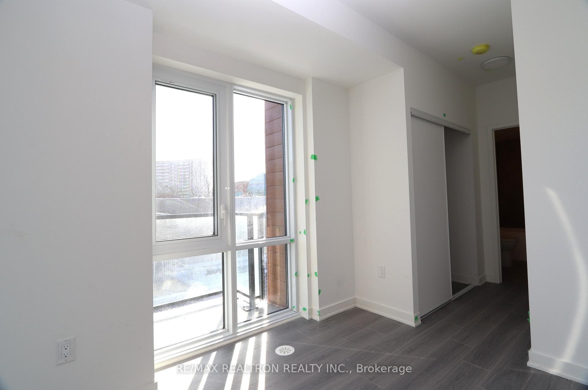Primary Bedroom Top-to-floor windows facing East.