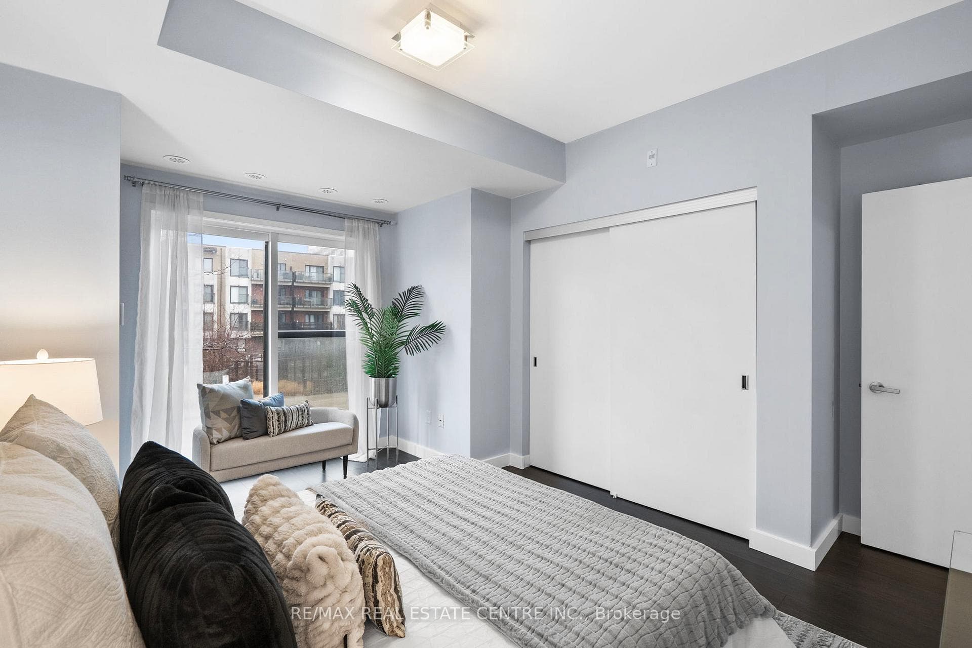 Primary bedroom with space for desk or lounge area