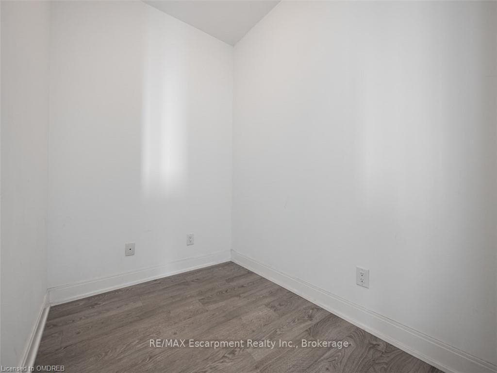 Spare room featuring hardwood / wood-style floorin