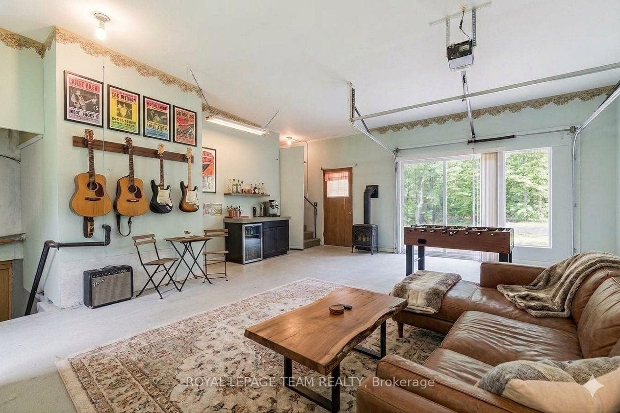 Former garage virtually staged as rec room.
