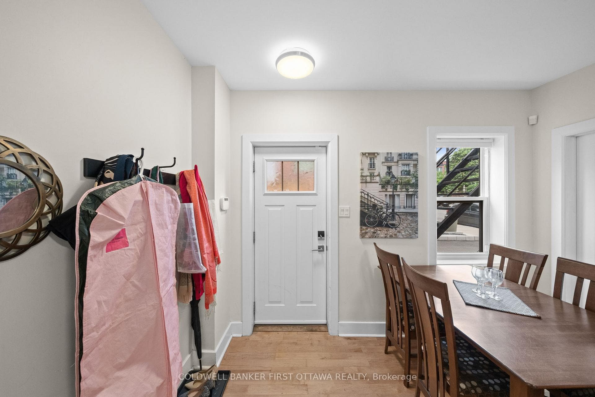 Main entrance door w coat rack.