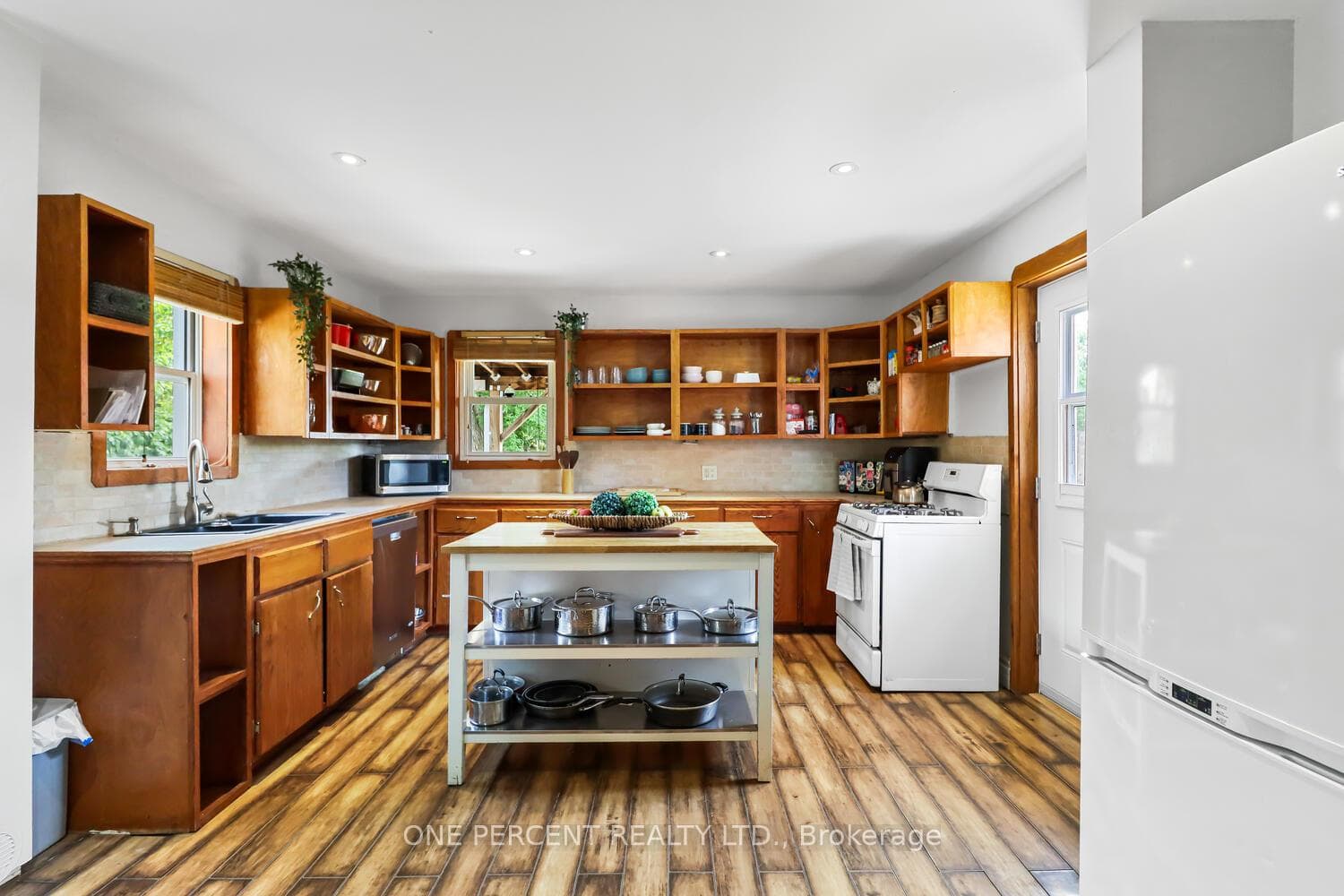 Open cabinetry, quaint kitchen