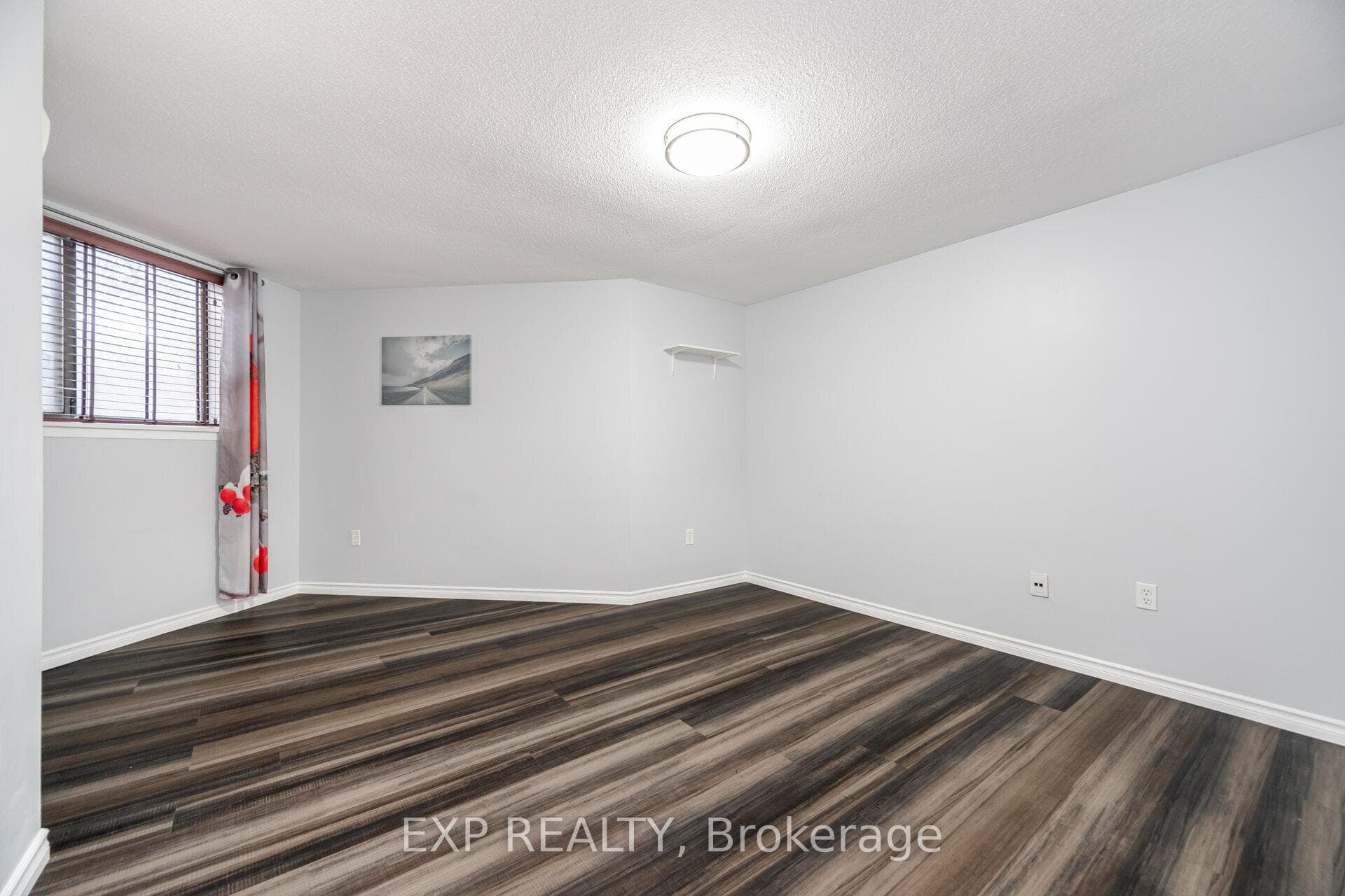 Large primary bedroom with new light fixture!