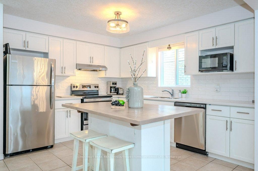 Kitchen with island seating for two