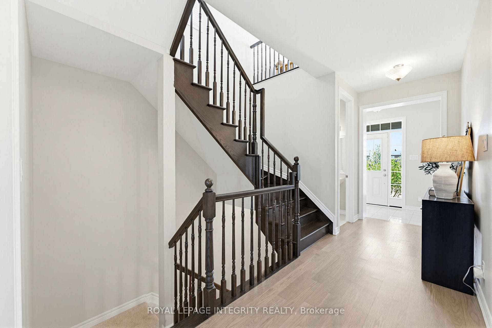 Bright foyer with elegant staircase