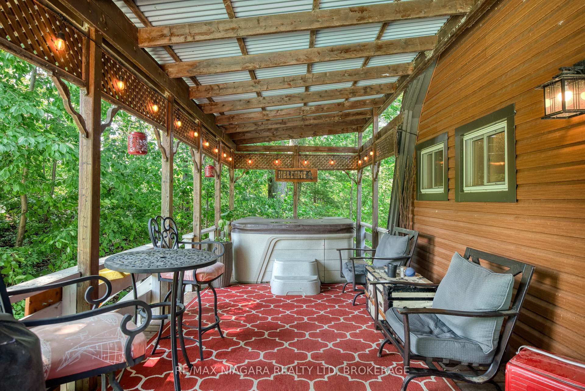 hot tub , covered deck next to pool