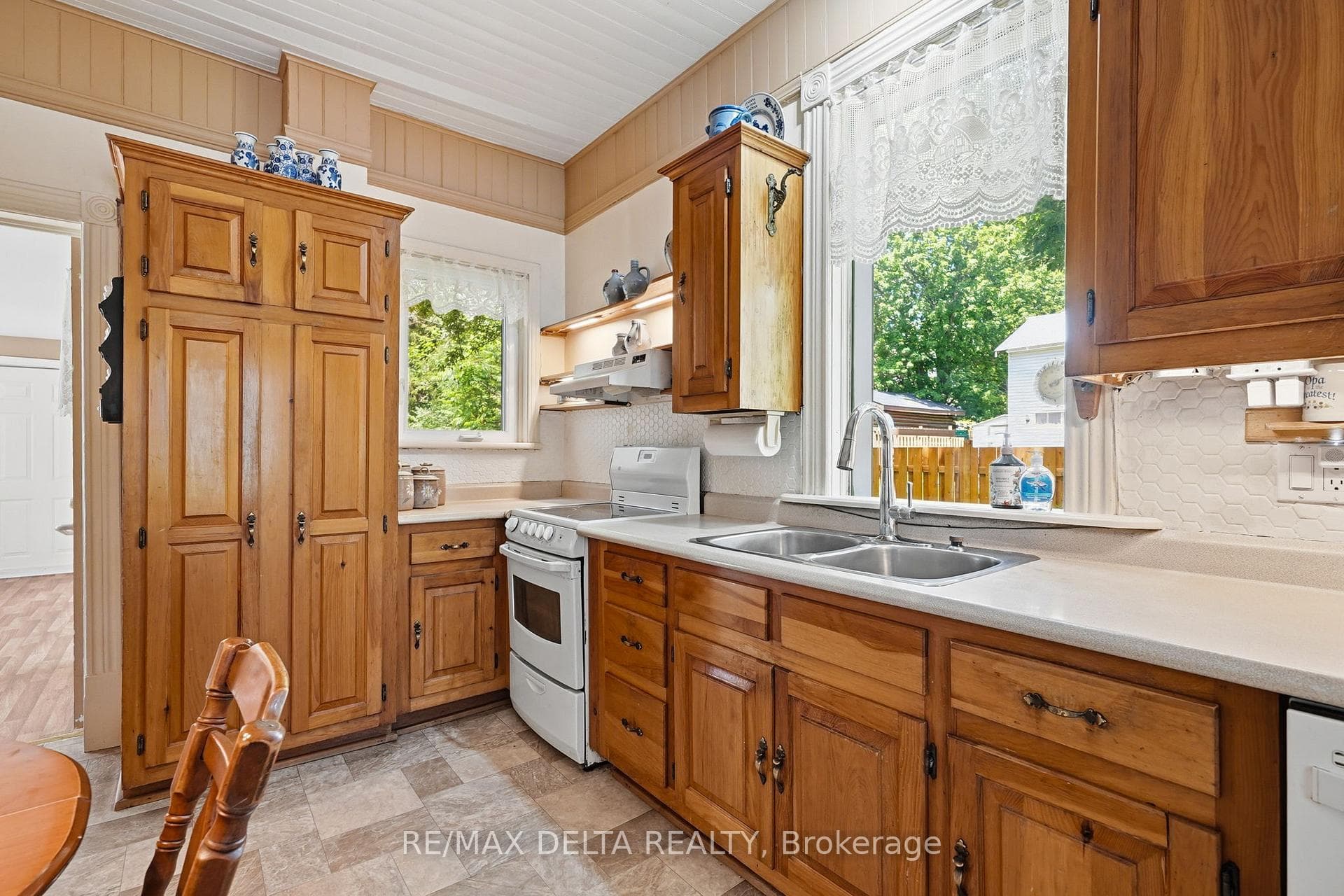 Two of three windows in the kitchen.