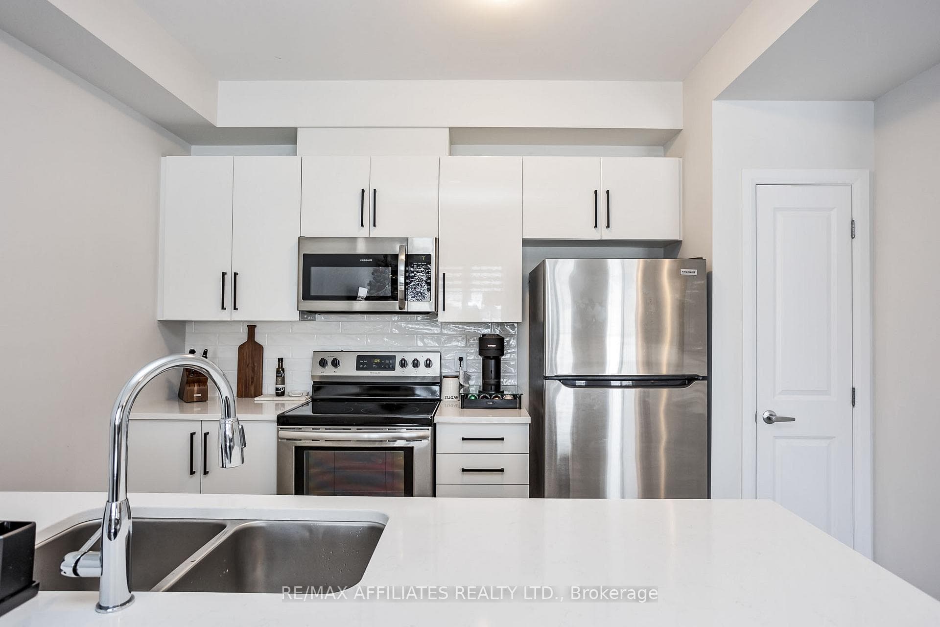 Quartz Counters, White Subway Backsplash & Pantry