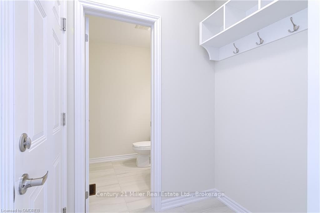 Bathroom featuring tile patterned floors and toile