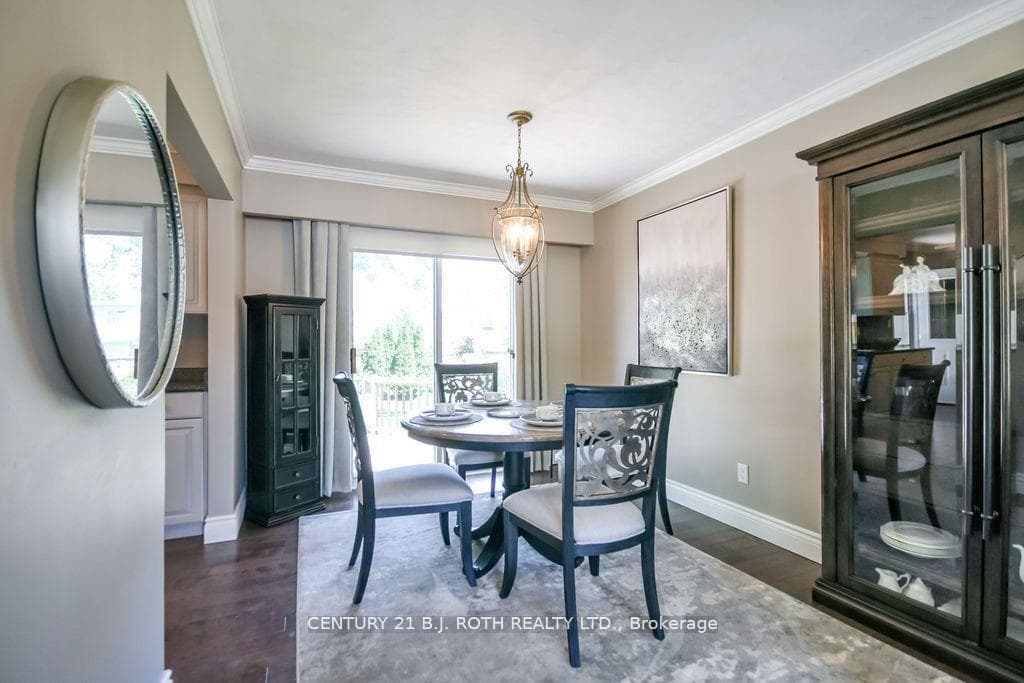 Dining room with hardwood flooring & sliding doors