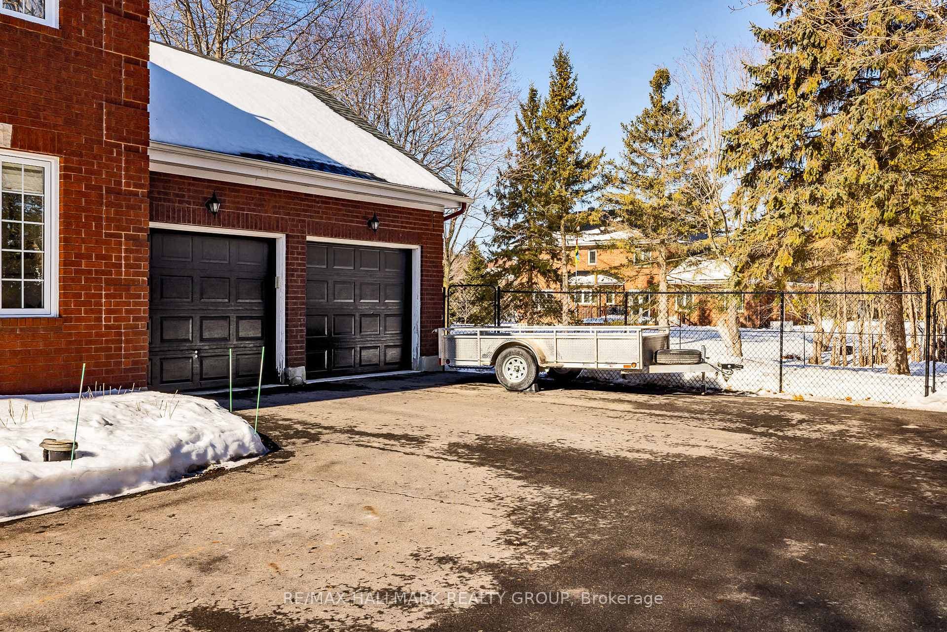 2 car garage at rear with doors & laneway in 2014.