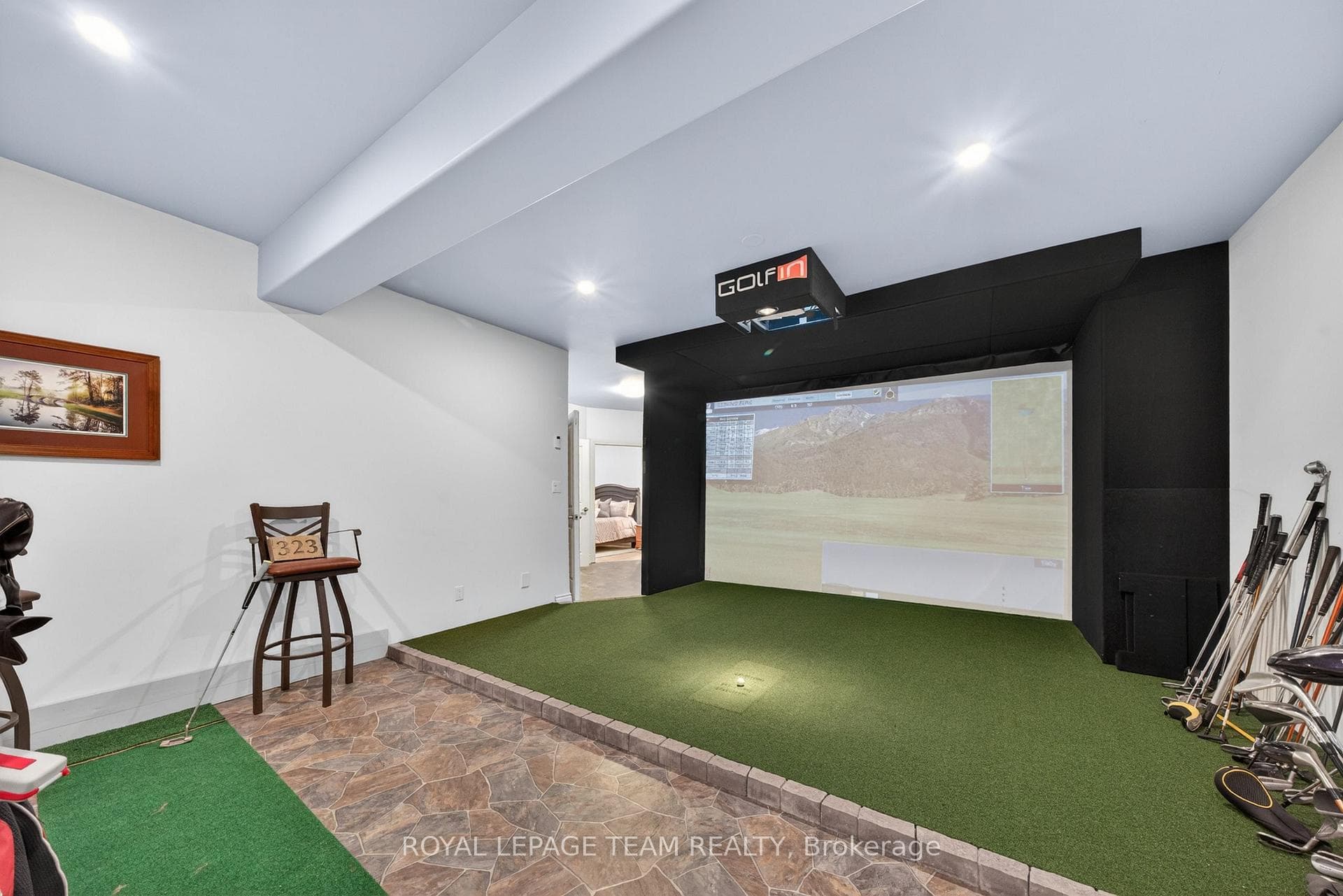 Golf simulator on lower level