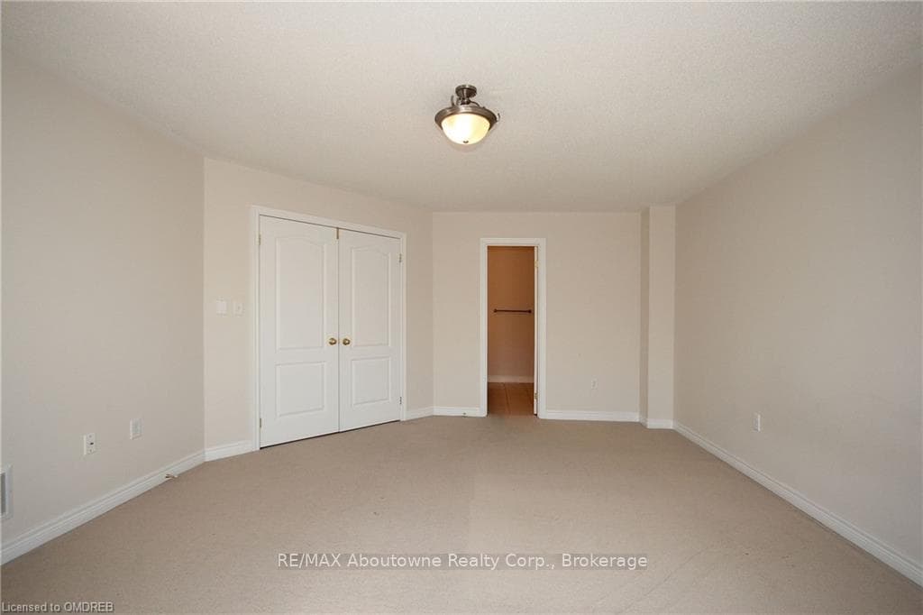 Unfurnished bedroom featuring a closet and carpet