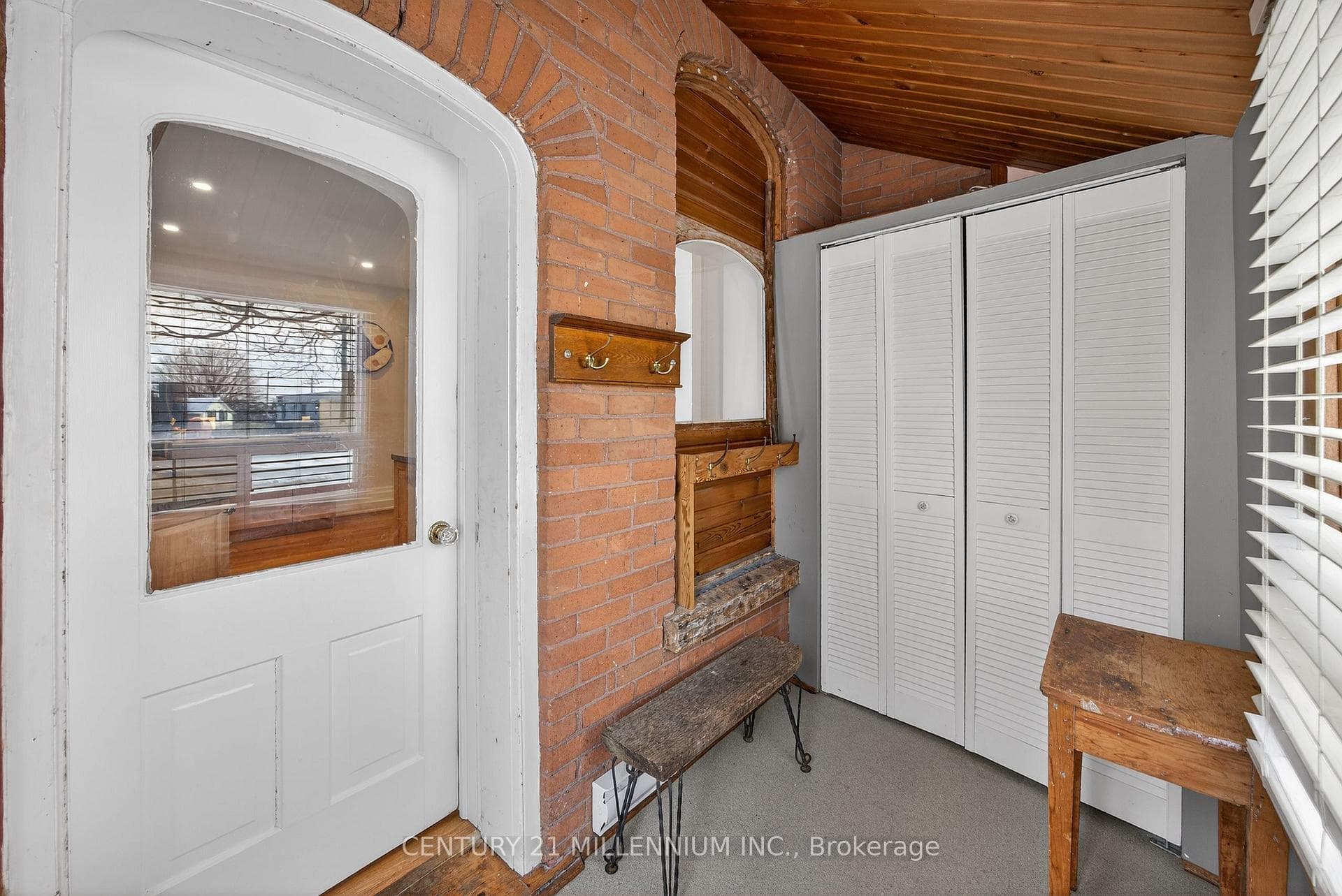 Side entrance mud room with a double closet.