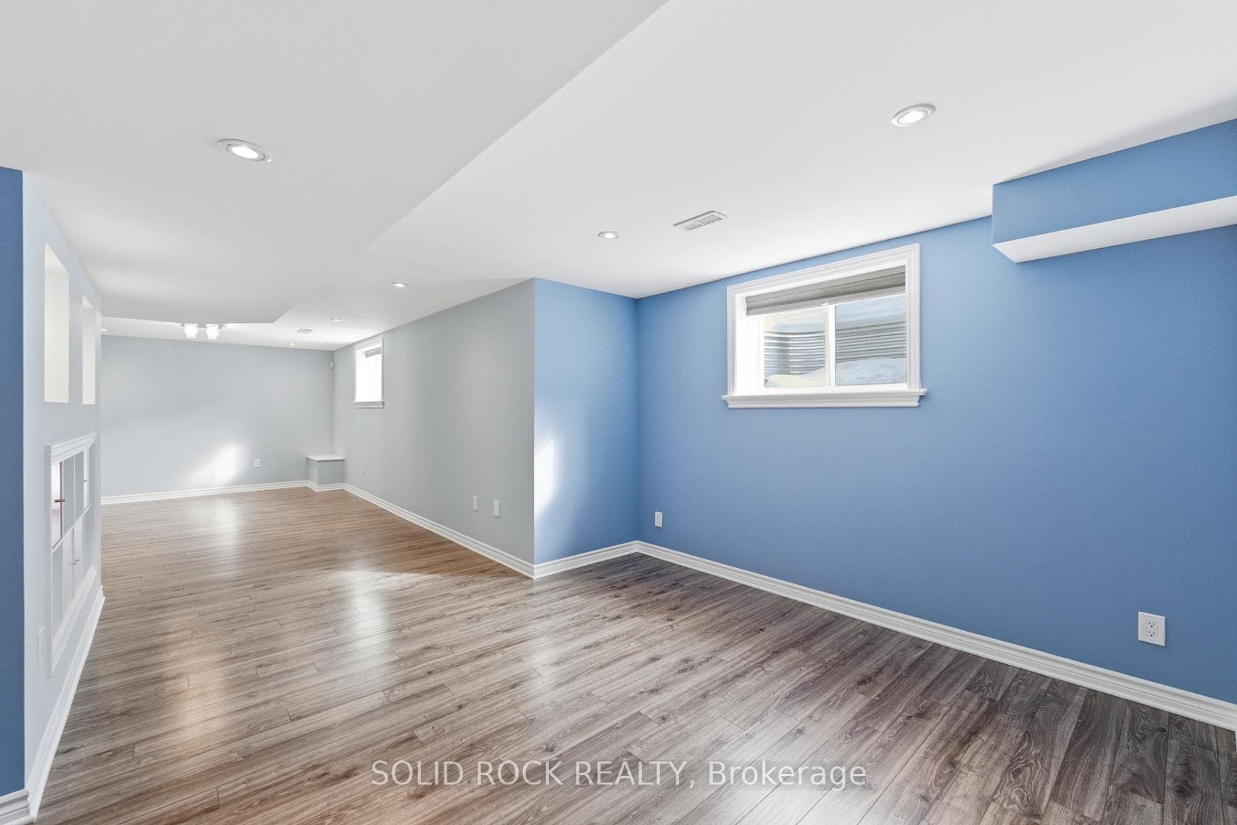 Large basement windows allow sunshine