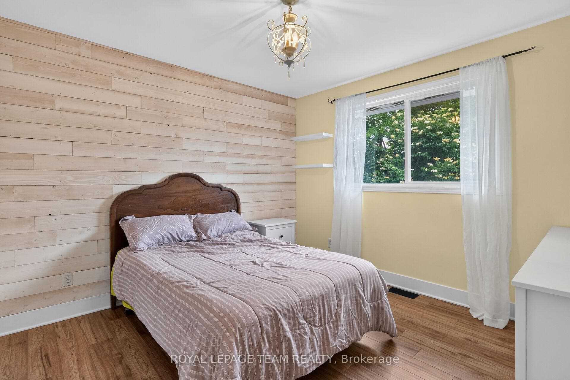 Main Level Bedroom w/laminate floors.