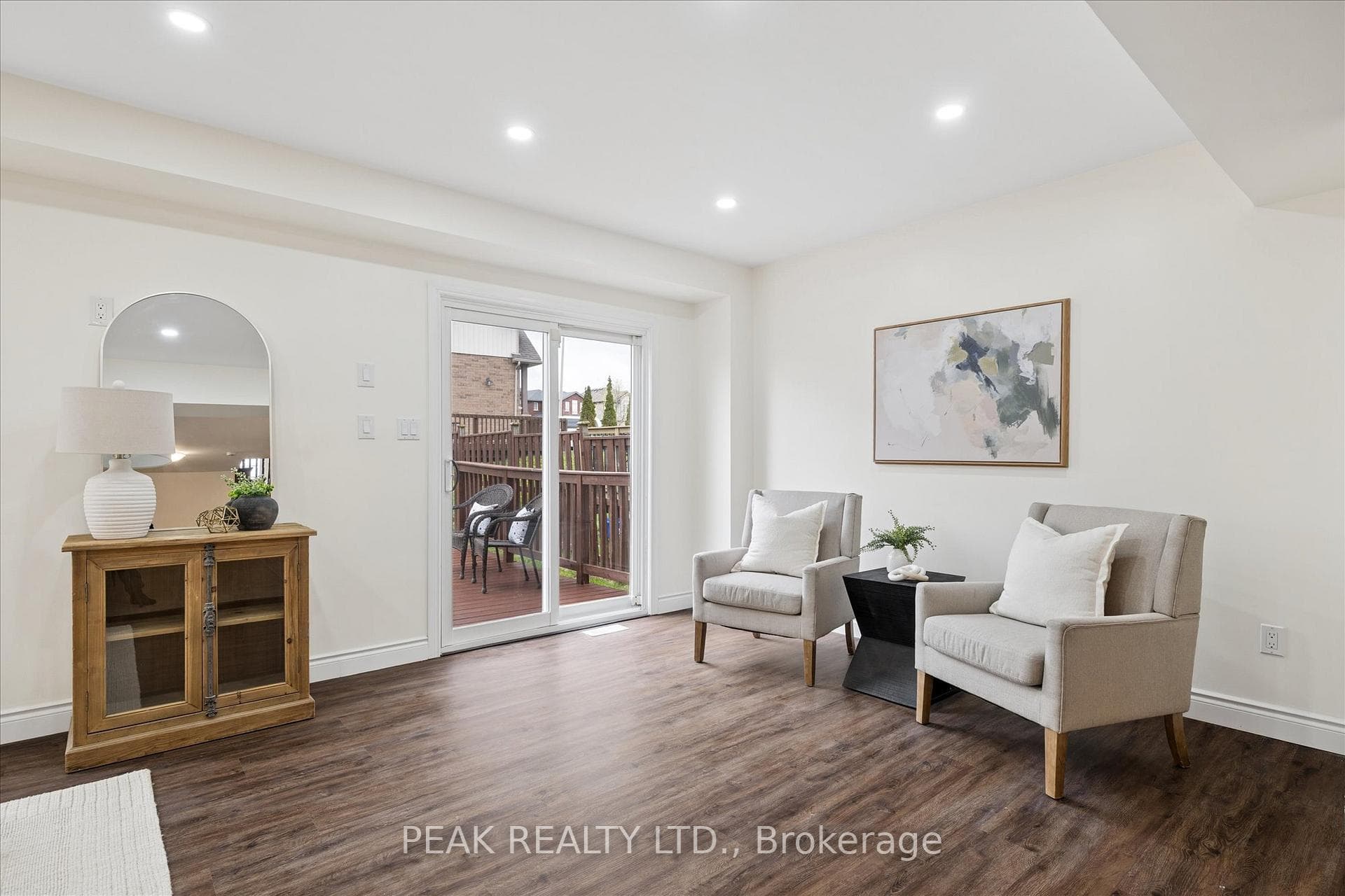 Living room with sliders to deck and backyard