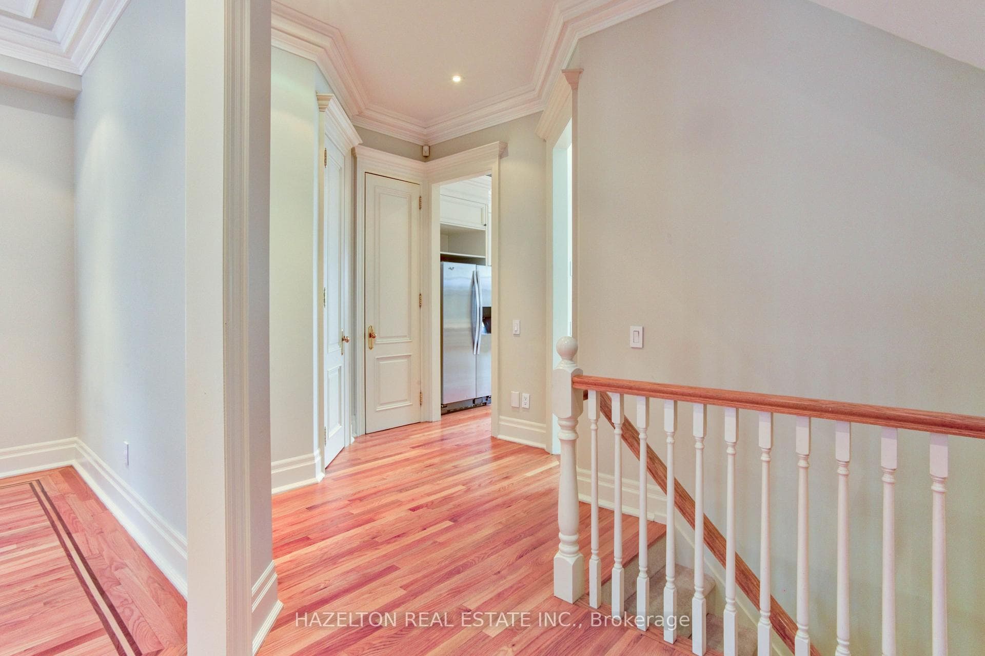 Central Hall With Open Stairs & Crown Moulding