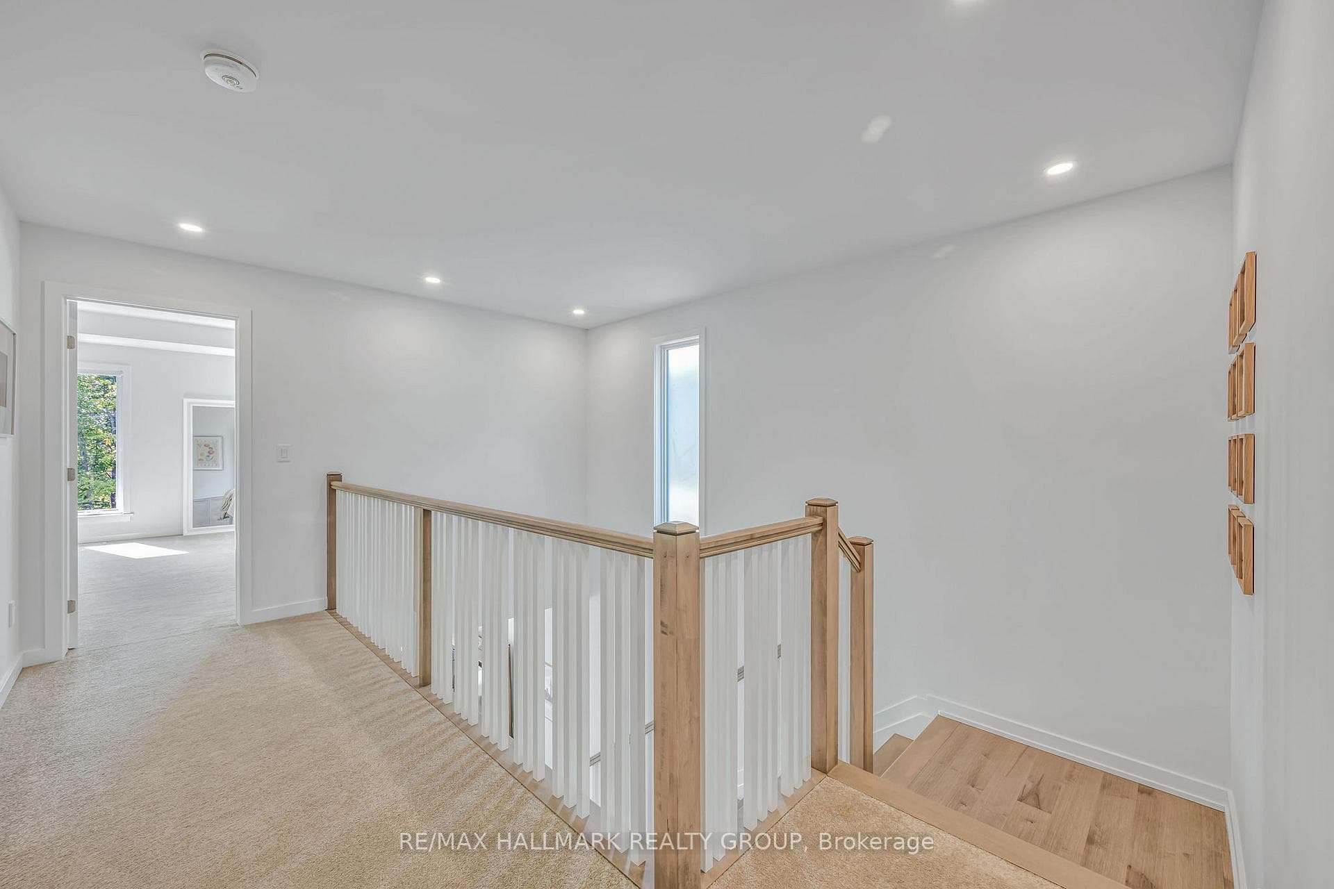 Upper hallway with hardwood floors