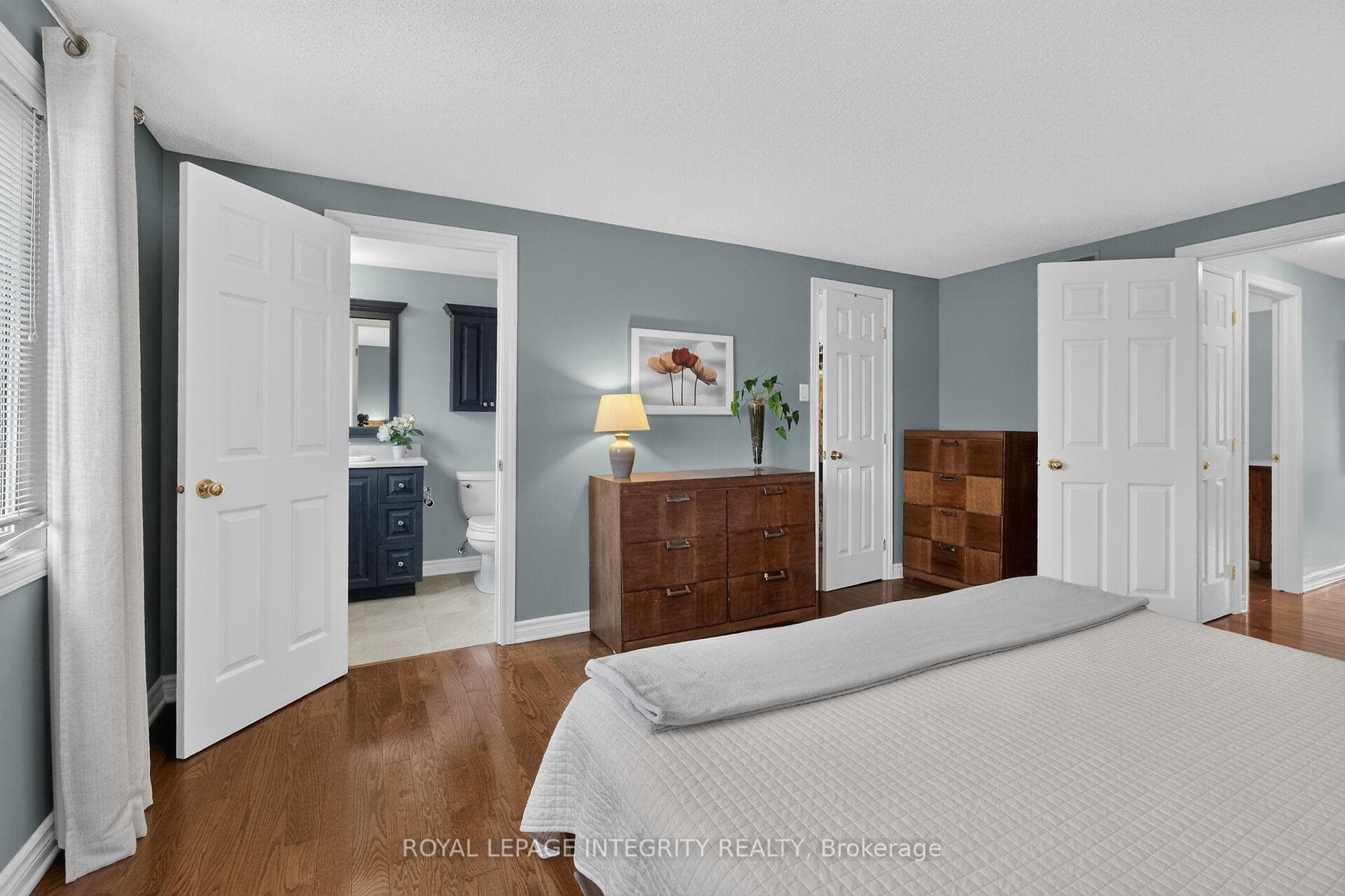 Ensuite and walk-in closet in primary bedroom