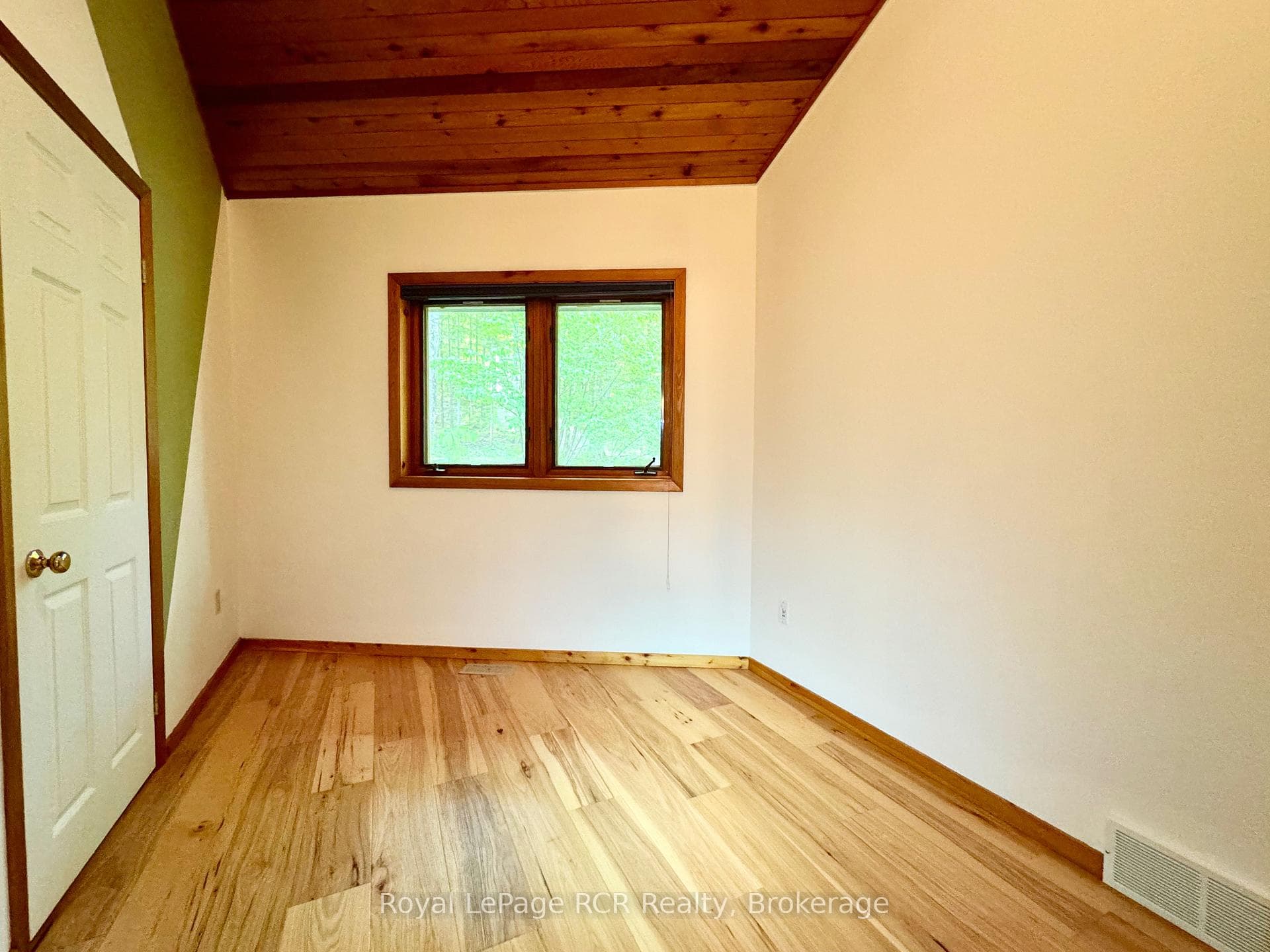 3rd main floor bedroom with vaulted ceiling.