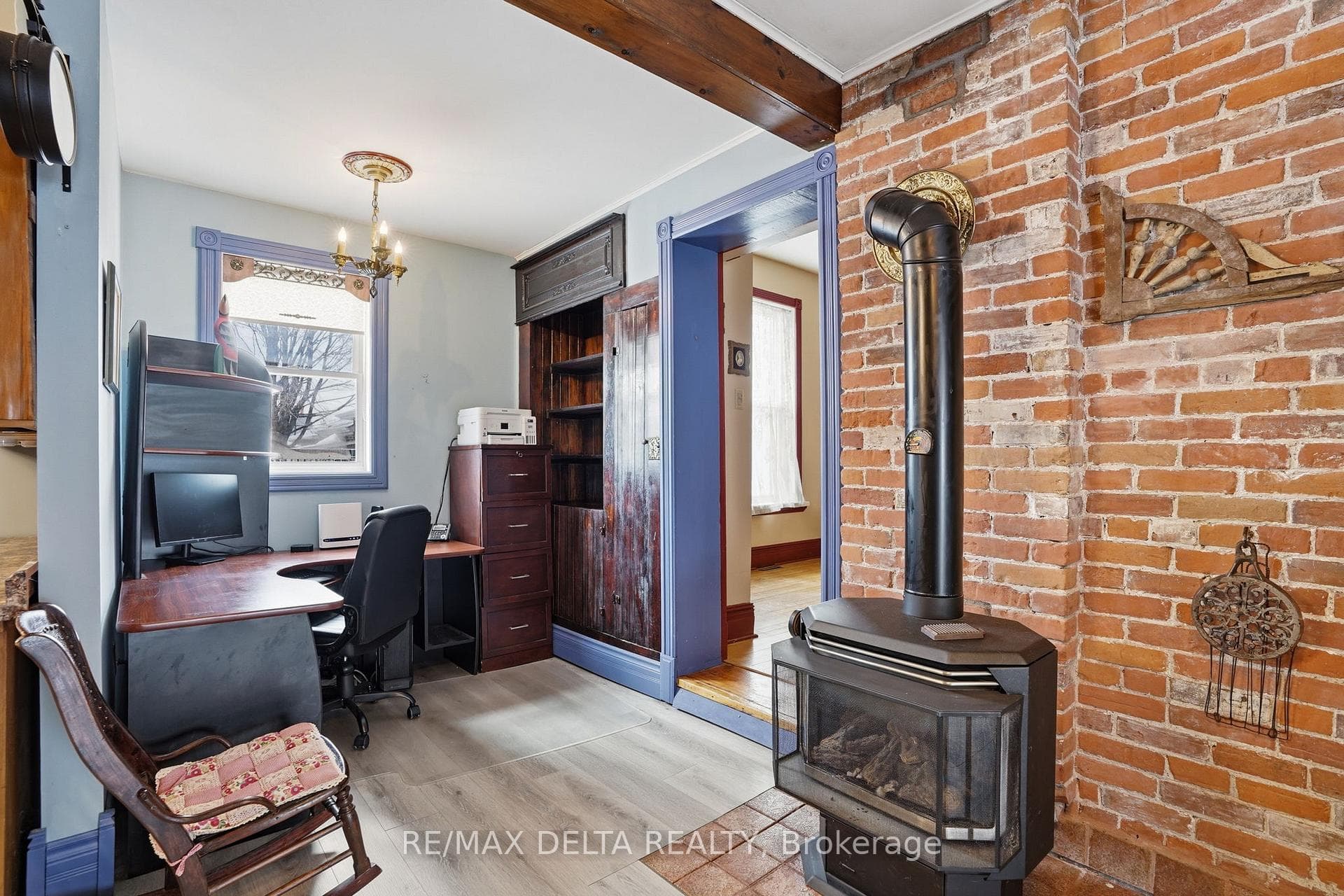 Newer gas stove in kitchen near breakfast nook.